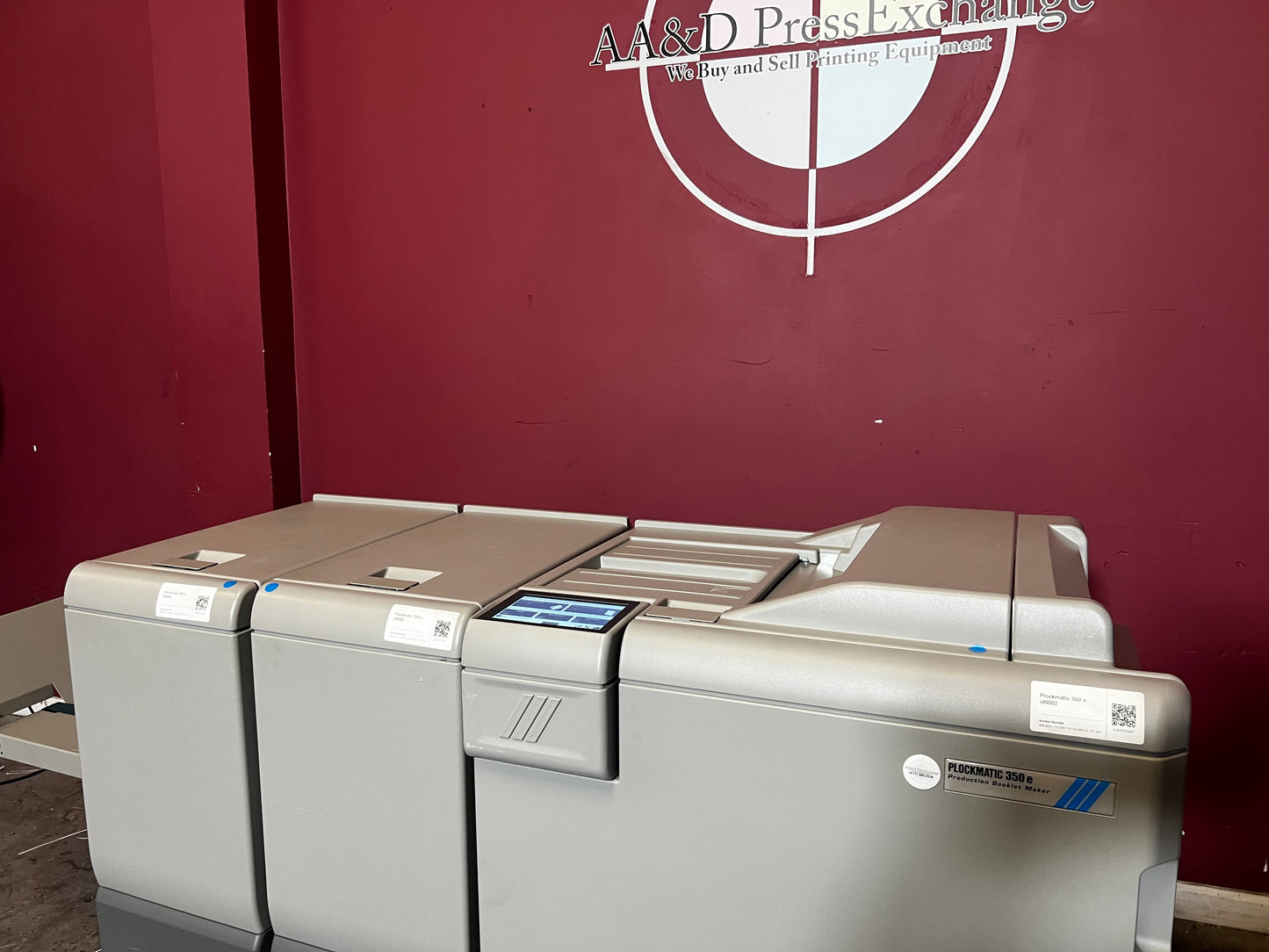 Used Plockmatic 350e booklet maker 120k meter front/side view in professional printing workflow – AA&D PressExchange