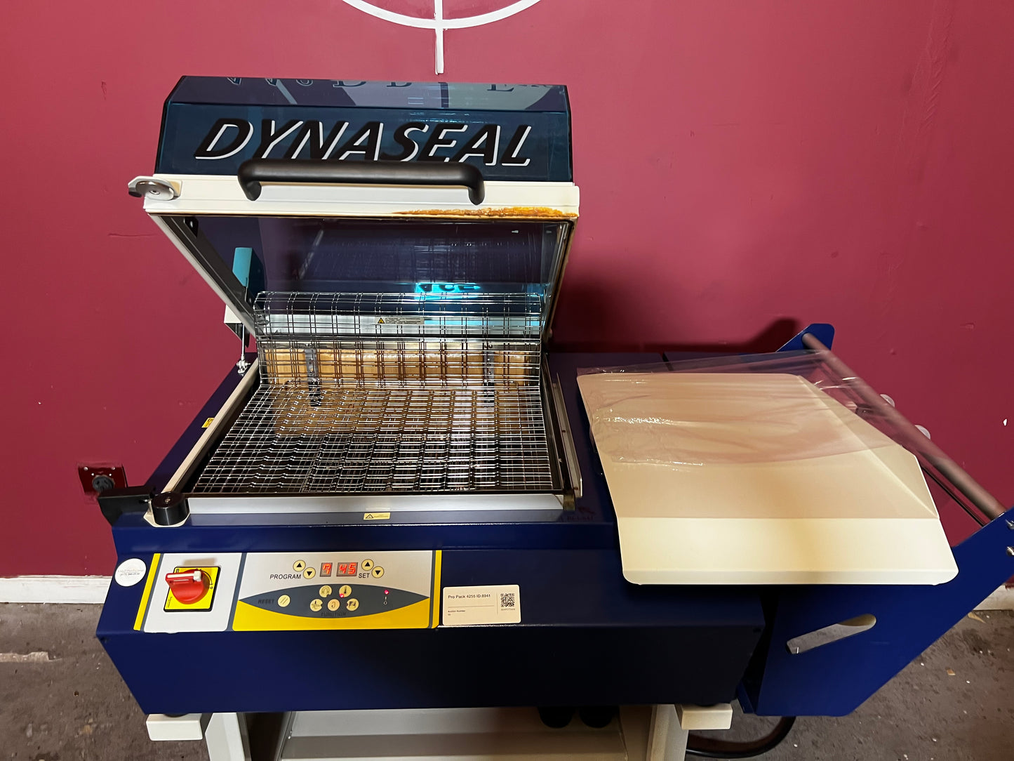 Used Dynaseal Shrink Wrapper top view of sealing and conveyor area – AA&D PressExchange
