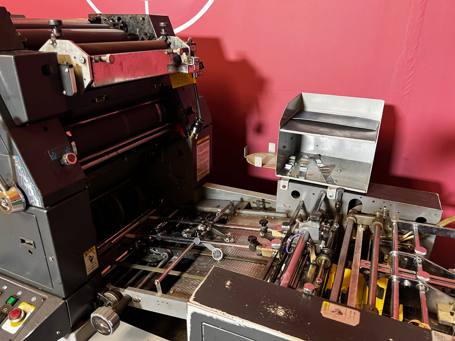 Used AB Dick 9985 offset press showing two-color printing cylinders – AA&D PressExchange