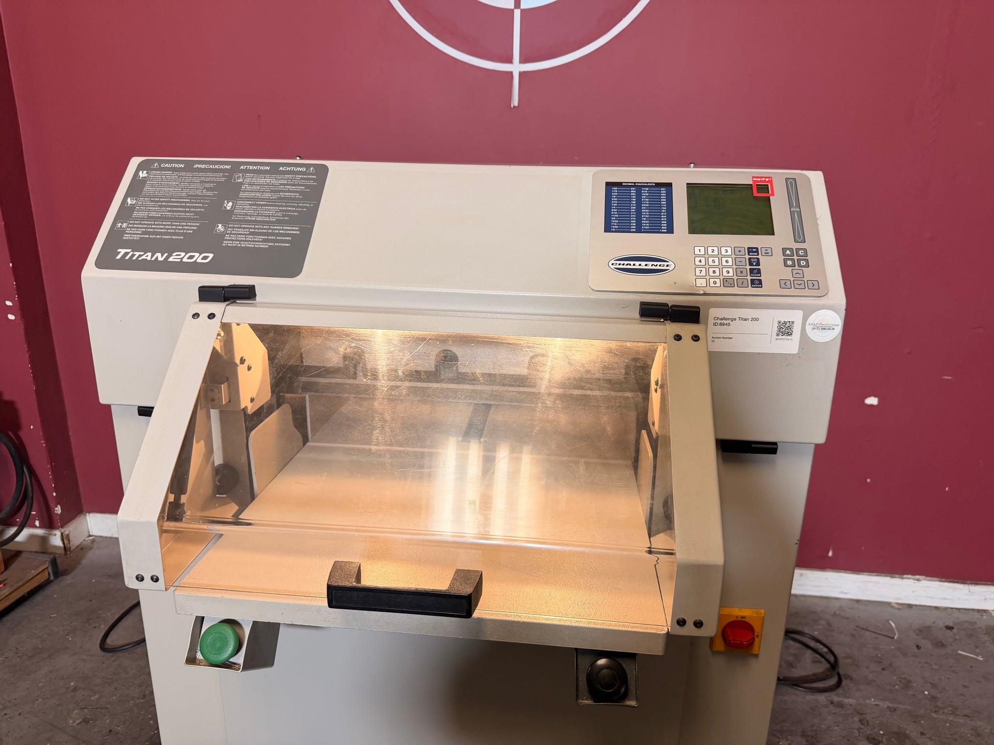 Used Challenge Titan 200 Hydraulic Paper Cutter by AA&D PressExchange, side angle showing machine body and controls