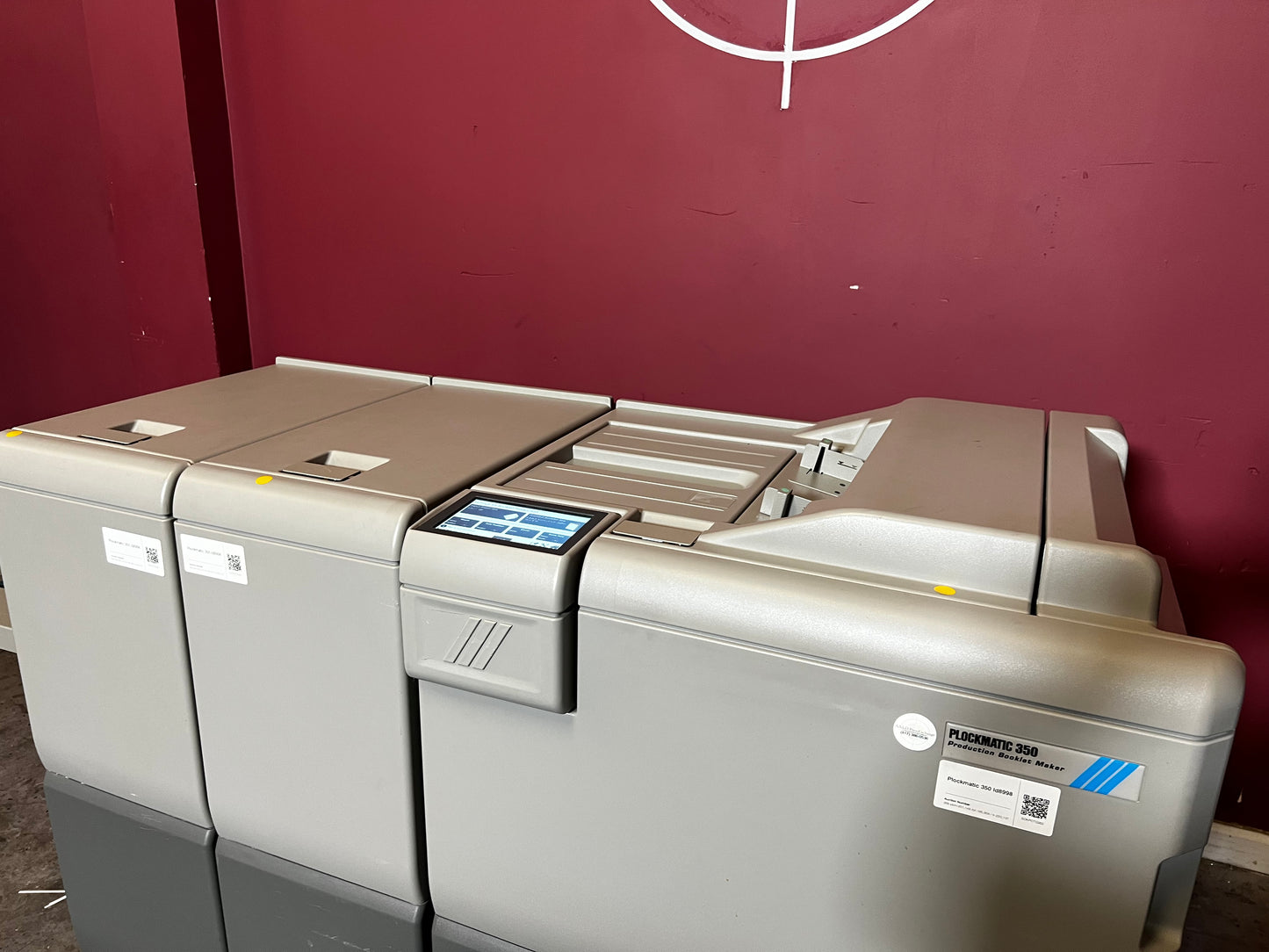 Used Plockmatic 350 200k meter booklet maker side view showing stitching mechanism – AA&D PressExchange