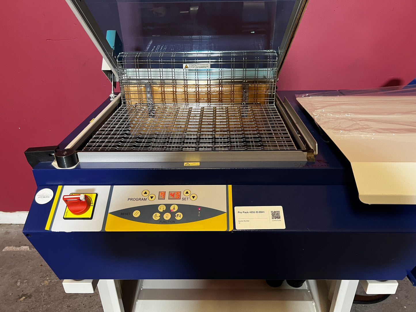 Used Dynaseal Shrink Wrapper angled front view showing overall machine design – AA&D PressExchange