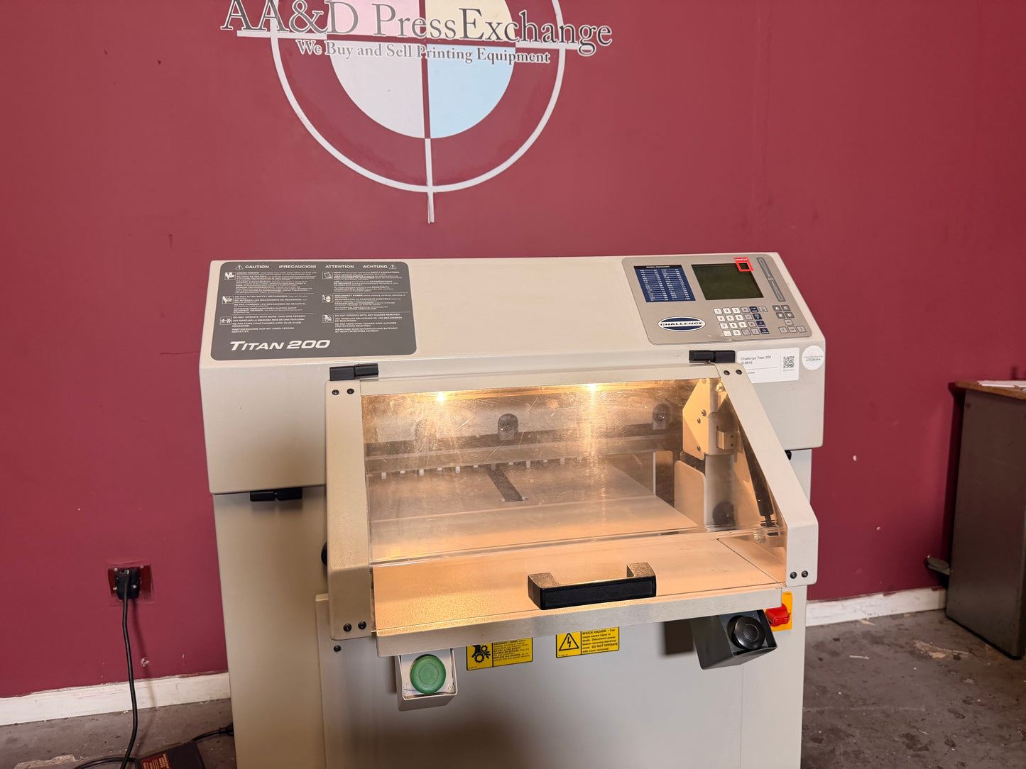 Used Challenge Titan 200 Hydraulic Paper Cutter by AA&D PressExchange, detailed view of LED cutting line and control panel