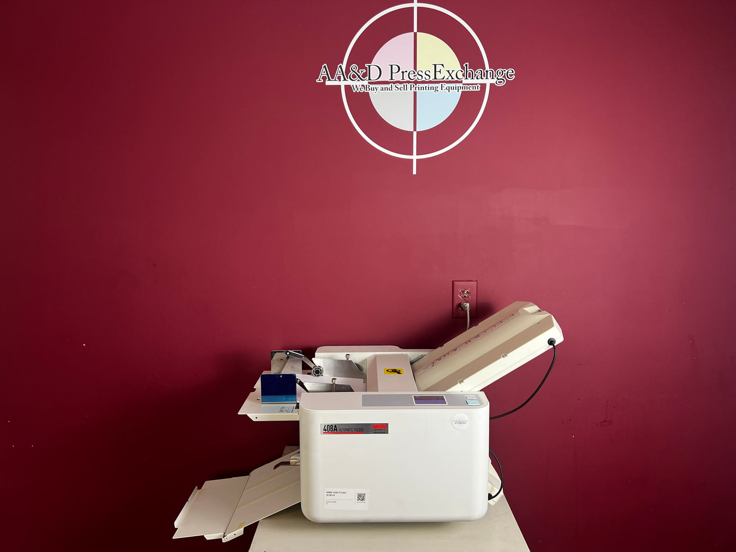 AA&D PressExchange Used MBM 408A paper folder featuring automatic 3-roller friction feed system