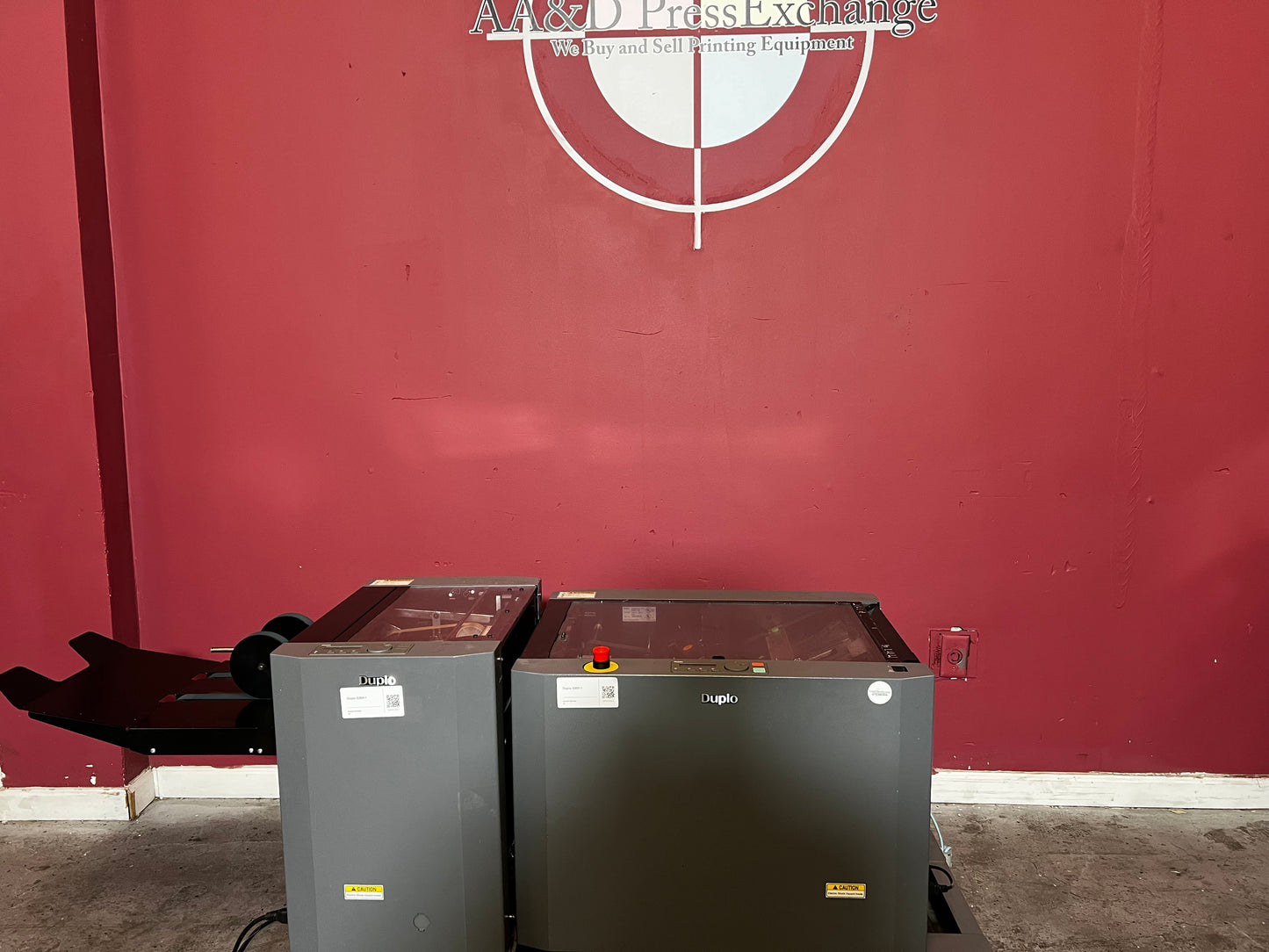 Used Duplo DBM-120 booklet maker with trimmer angled rear view in print production environment – AA&D PressExchange