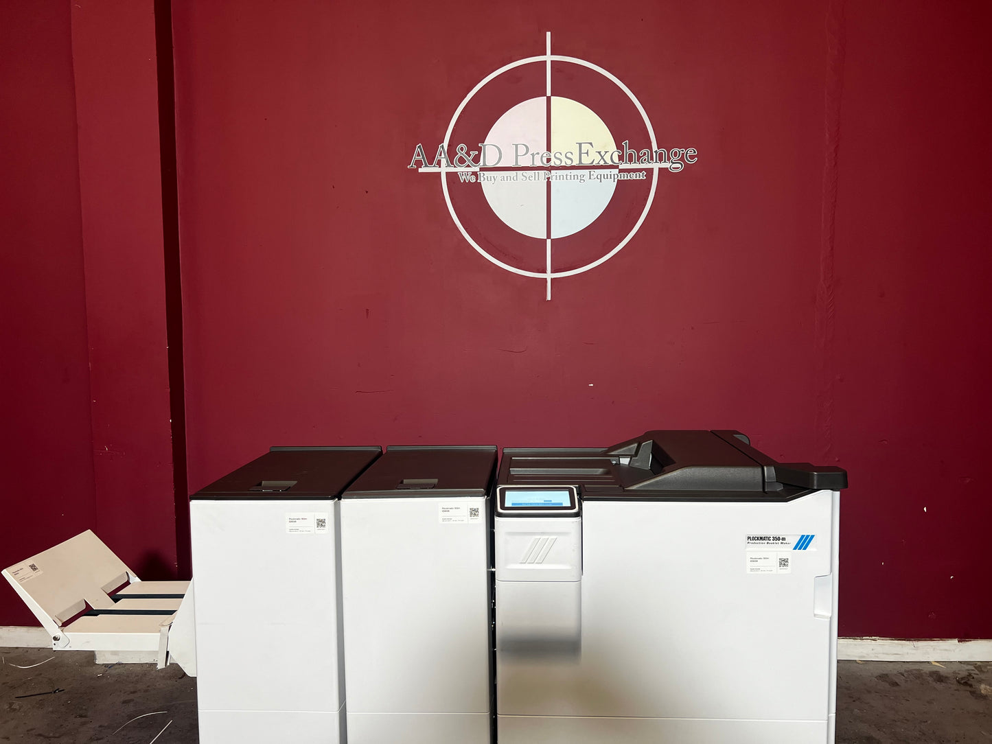 Used Plockmatic 350-M booklet maker 28k meter front view in professional print setup – AA&D PressExchange