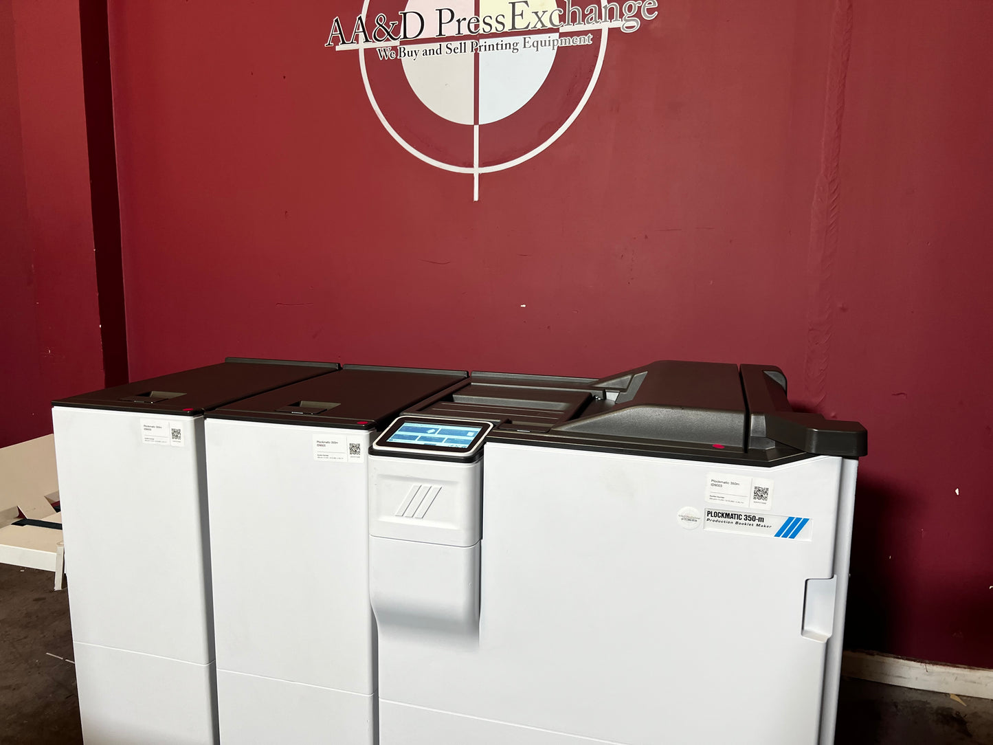 Used Plockmatic 350-M 85k meter booklet maker angled view showing saddle-stitch module – AA&D PressExchange