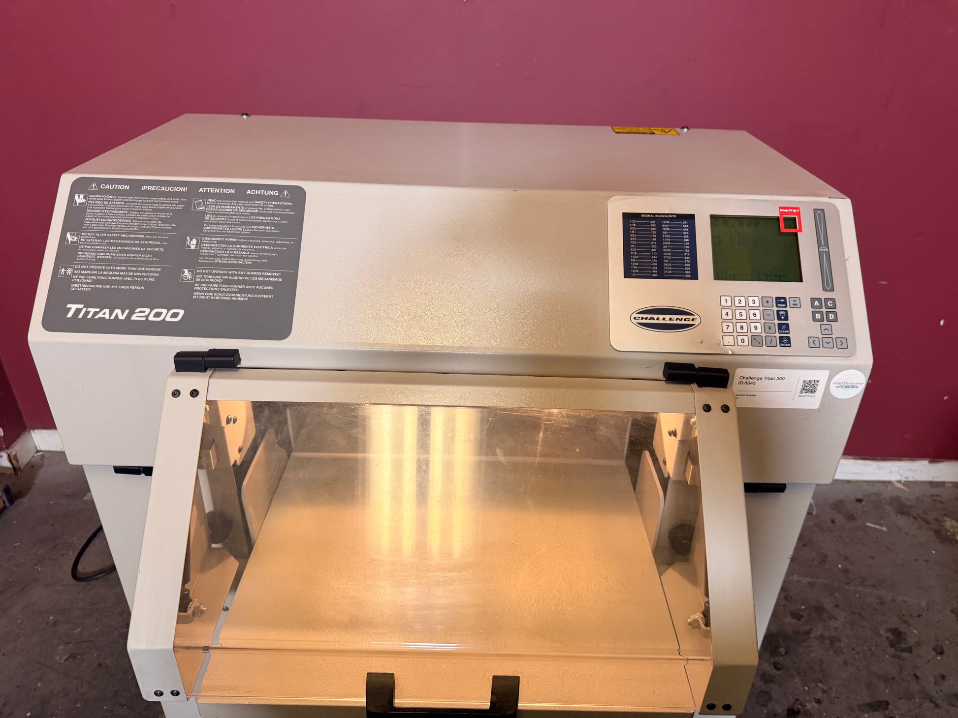 Used Challenge Titan 200 Hydraulic Paper Cutter by AA&D PressExchange, side view highlighting hydraulic clamp