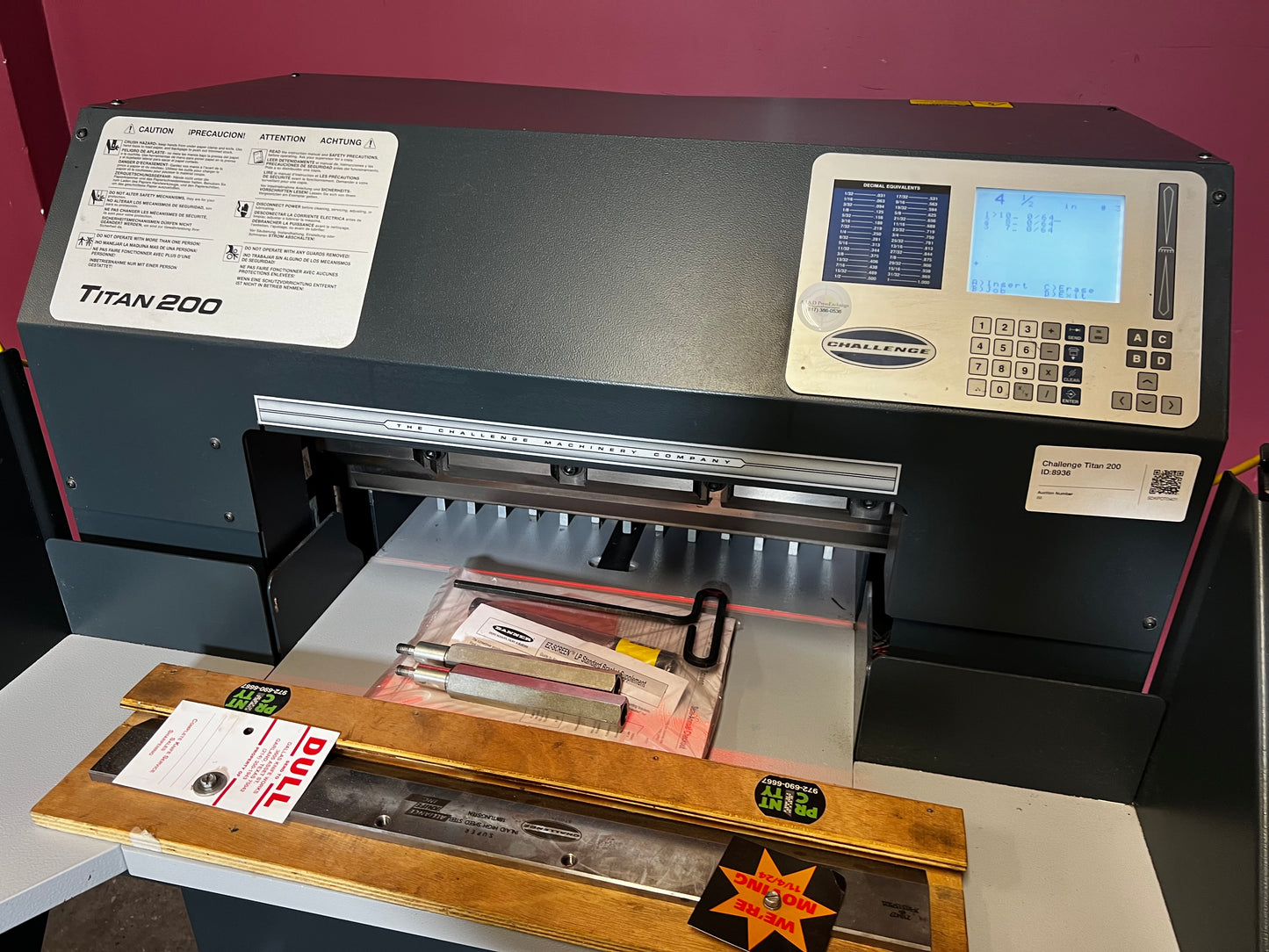 Used Challenge Titan 200C hydraulic paper cutter close-up of cutting table and floating back gauge fingers – AA&D PressExchange