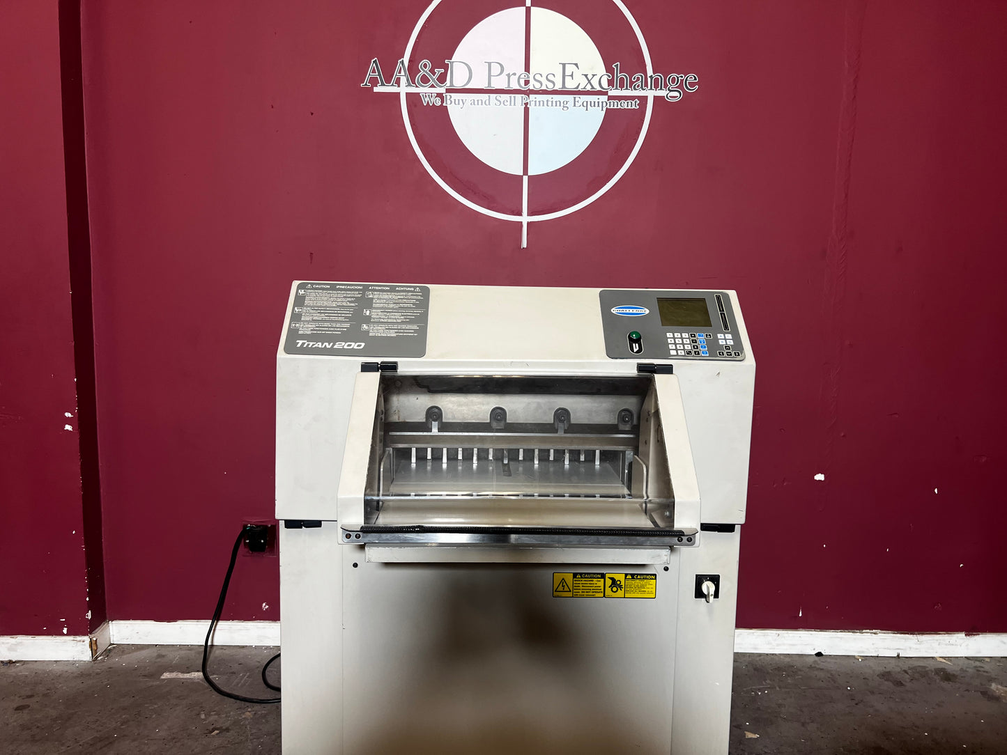 Close-up of AA&D PressExchange used Challenge Titan 200 Paper Cutter safety latch and tilt shield.