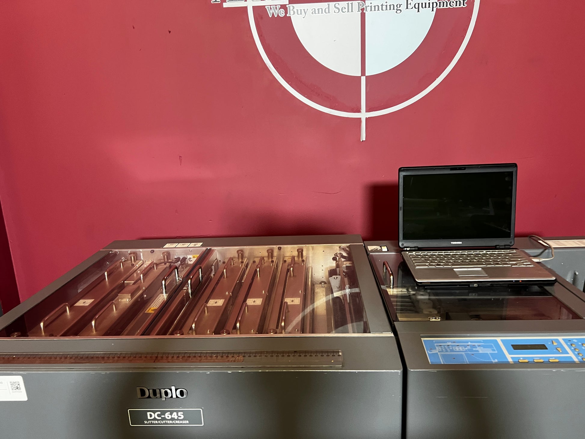 Used Duplo DC-645 Slitter Cutter Creaser top view of slitter and creaser units – AA&D PressExchange