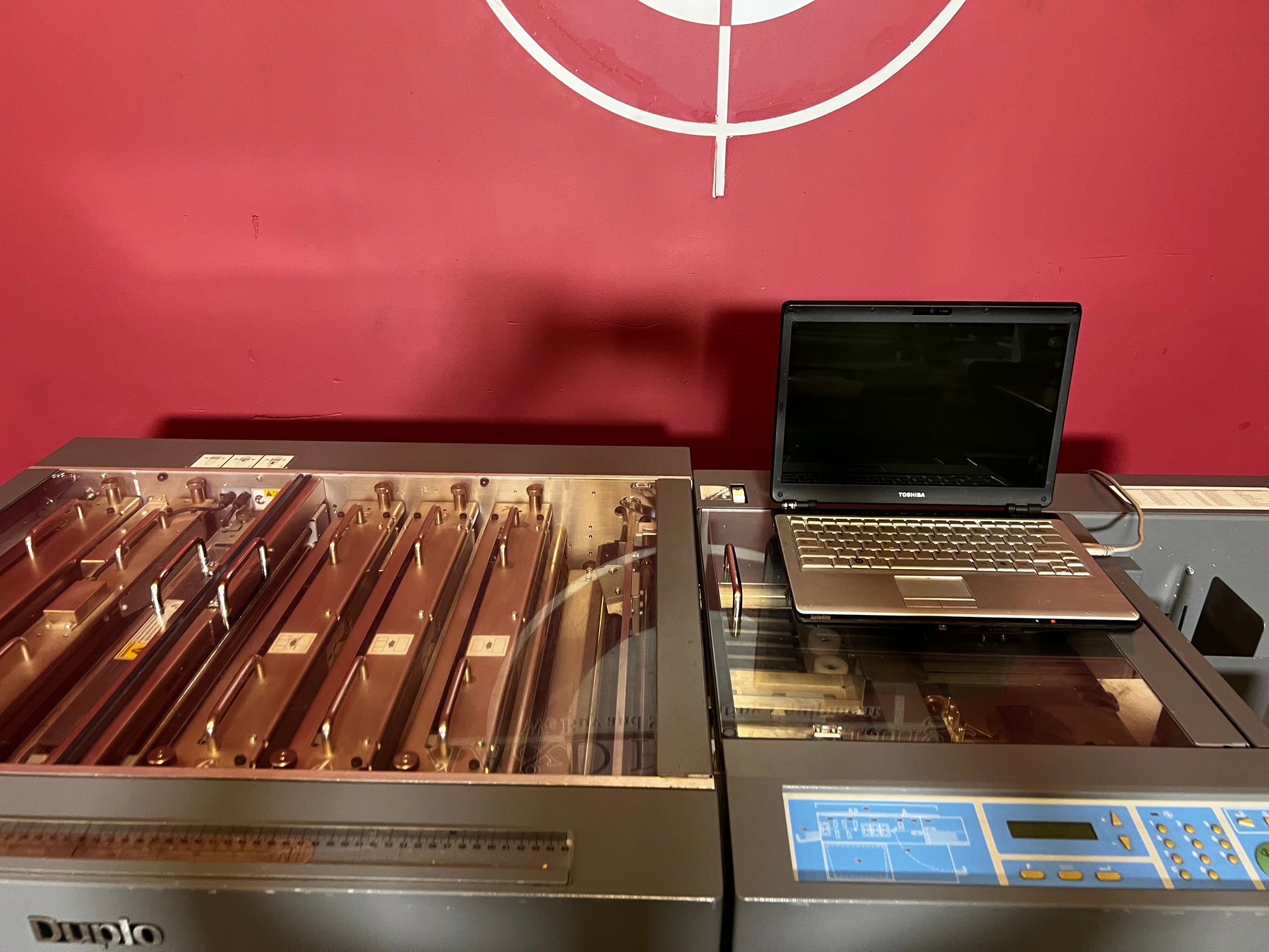 Used Duplo DC-645 Slitter Cutter Creaser close-up of creasing and cutting mechanism – AA&D PressExchange