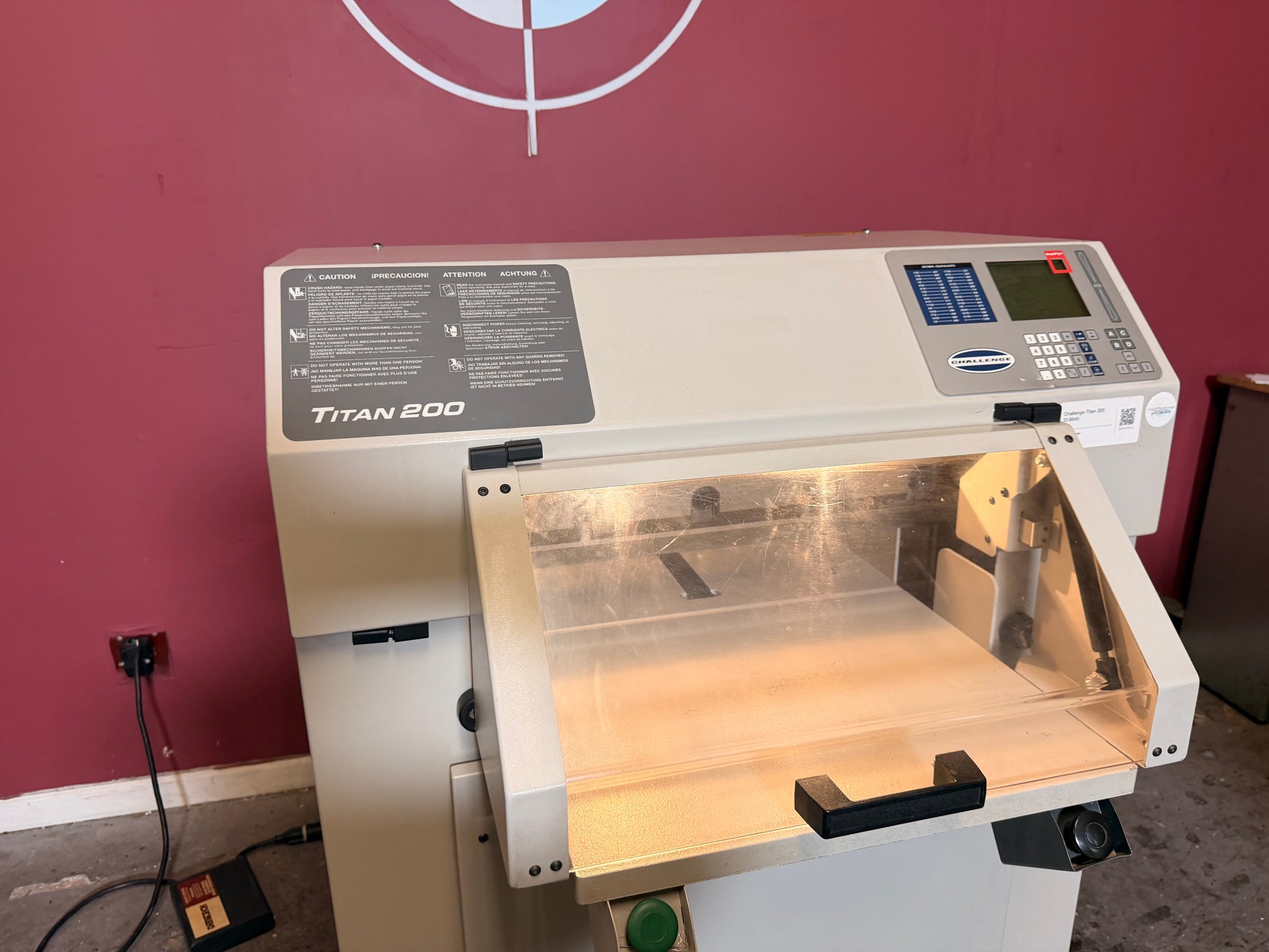 Used Challenge Titan 200 Hydraulic Paper Cutter by AA&D PressExchange, close-up of cutting blade and LED indicator