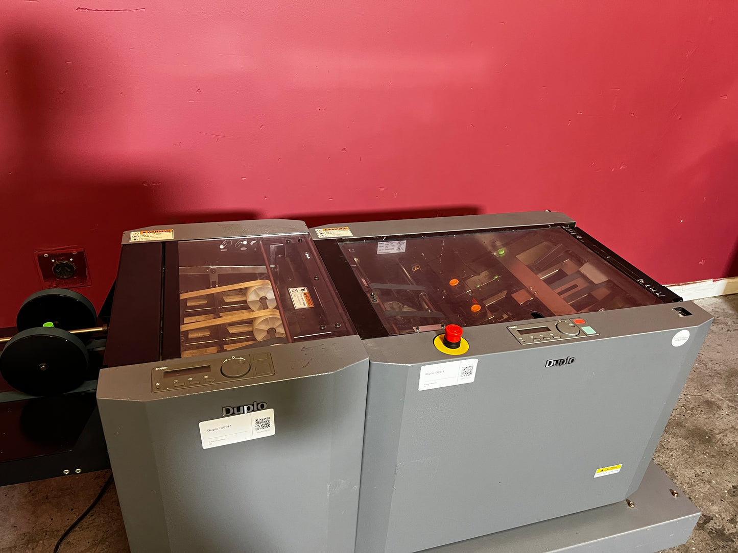 Used Duplo DBM-120 booklet maker with trimmer side view in short-run production setup – AA&D PressExchange