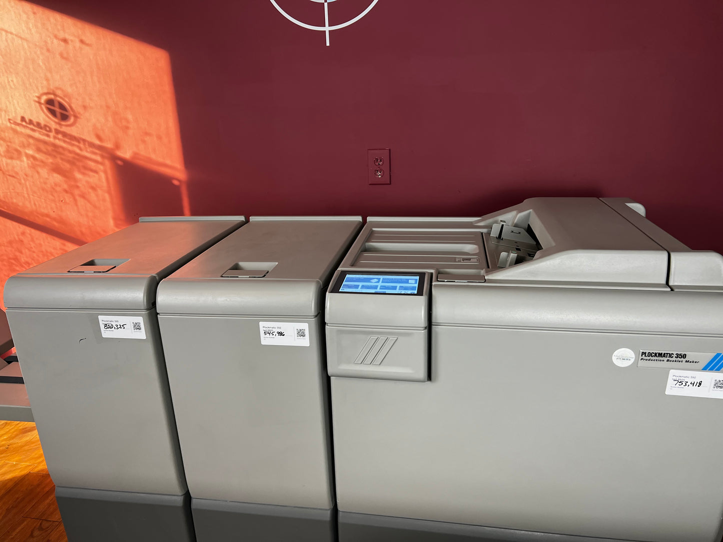 Used Plockmatic 350 booklet maker top-down view of booklet output area – AA&D PressExchange