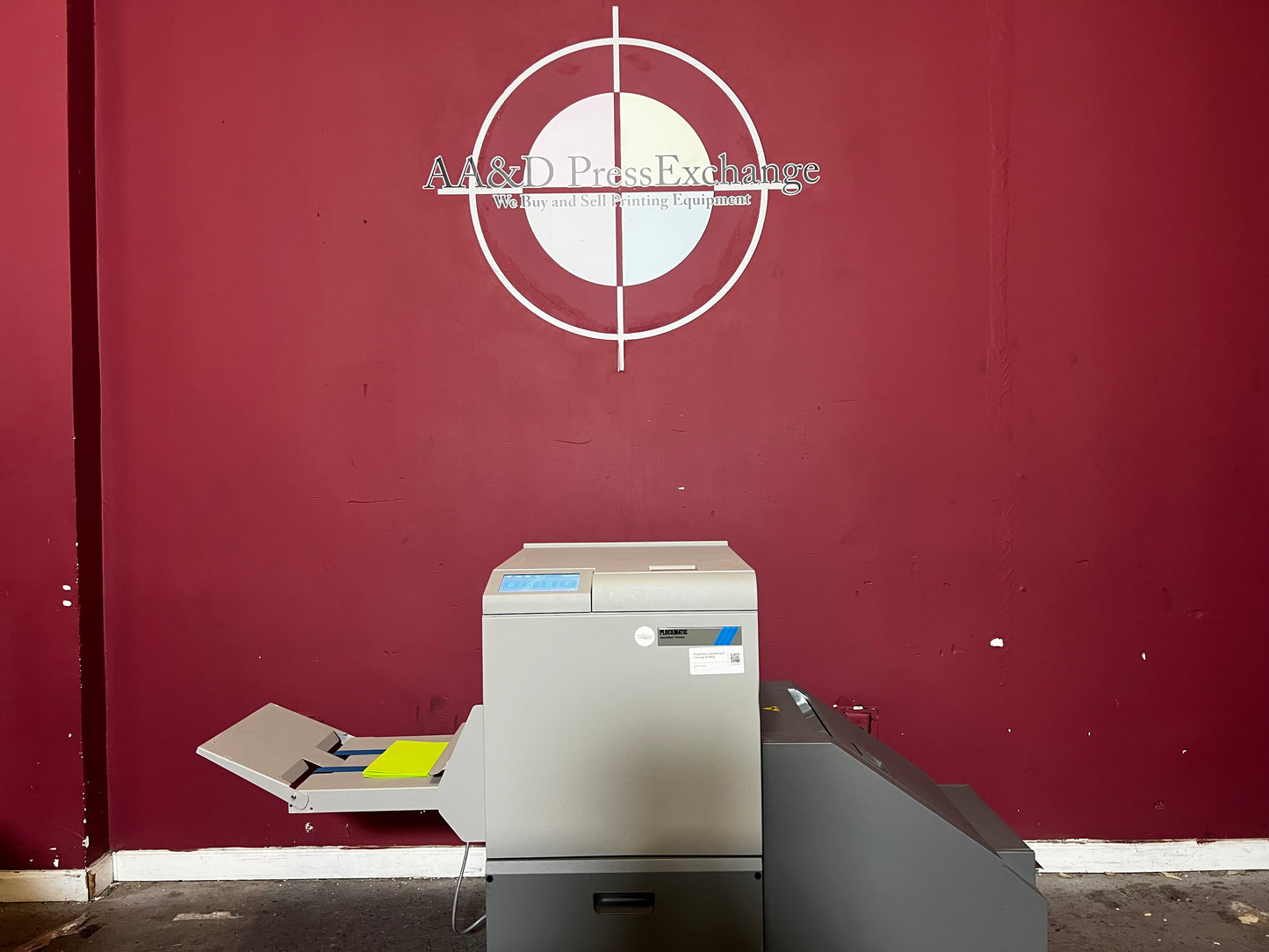Used Plockmatic SquareBack Trimmer close-up of output booklet with square spine finish – AA&D PressExchange