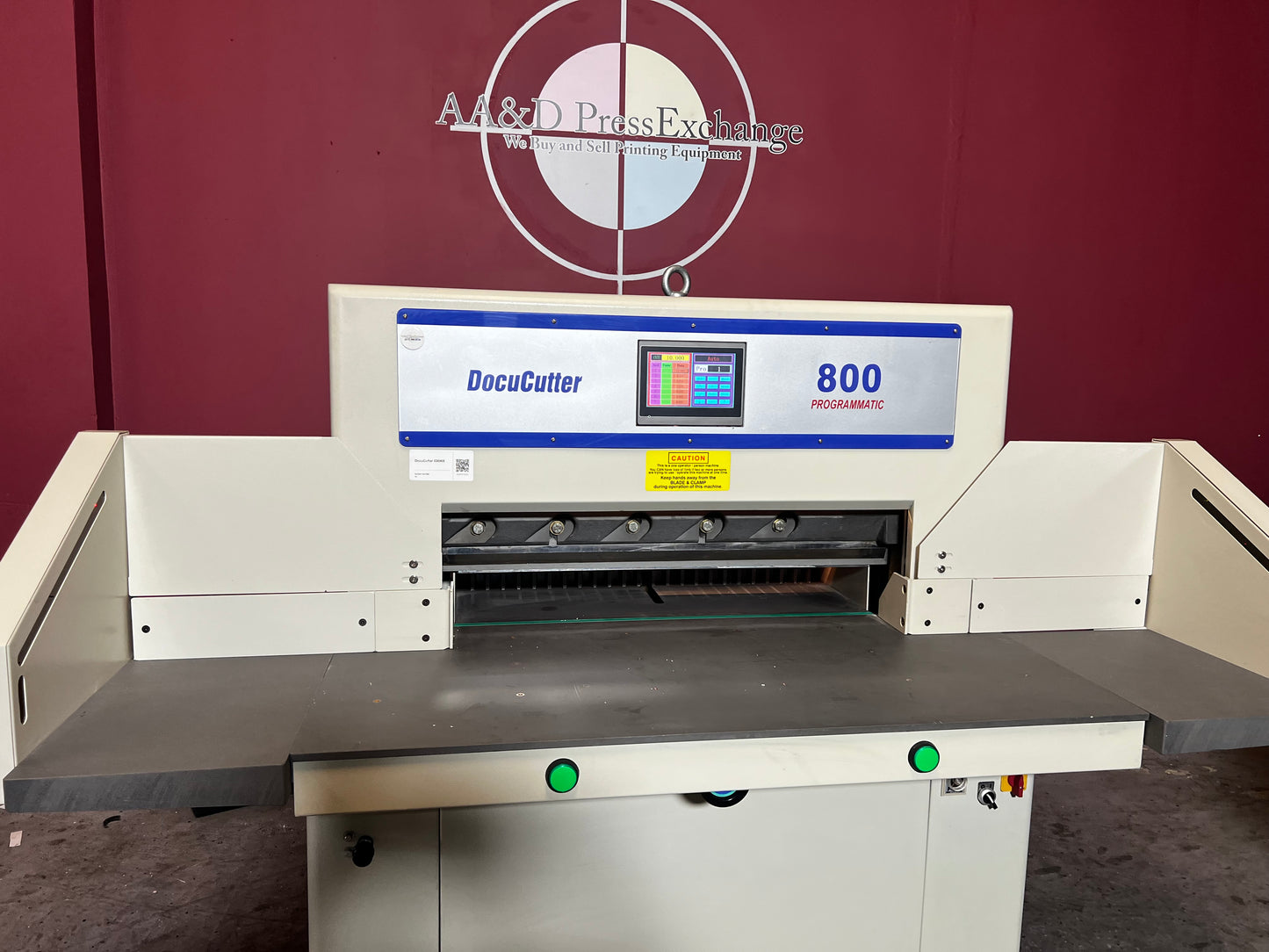 Used Duplo Docucutter 800 Programmatic paper cutter angled view in professional print setup – AA&D PressExchange