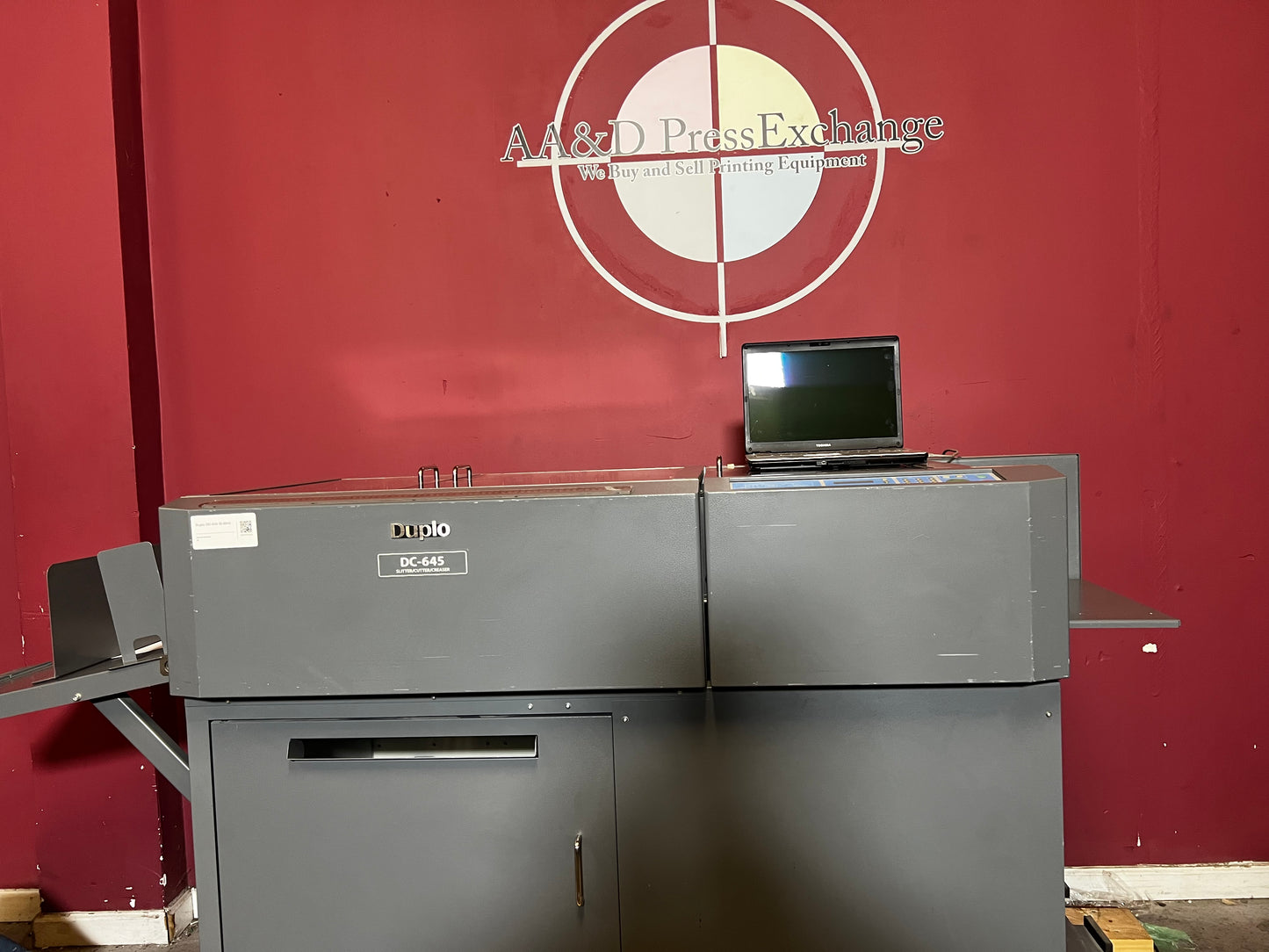 Used Duplo DC-645 Slitter Cutter Creaser angled close-up of cutting blades and creasing wheels – AA&D PressExchange