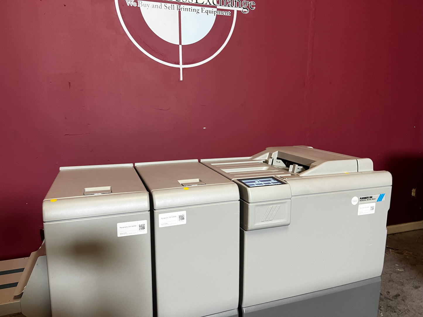 Used Plockmatic 350 200k meter booklet maker showing feed and stitch modules in operation – AA&D PressExchange