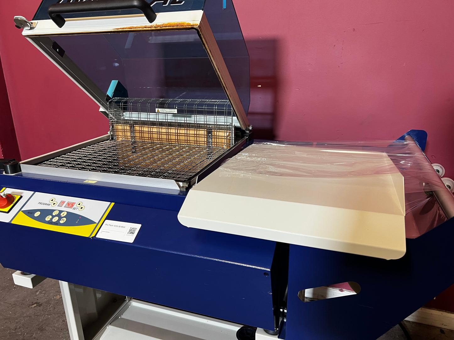 Used Dynaseal Shrink Wrapper rear view highlighting electrical and mechanical components – AA&D PressExchange