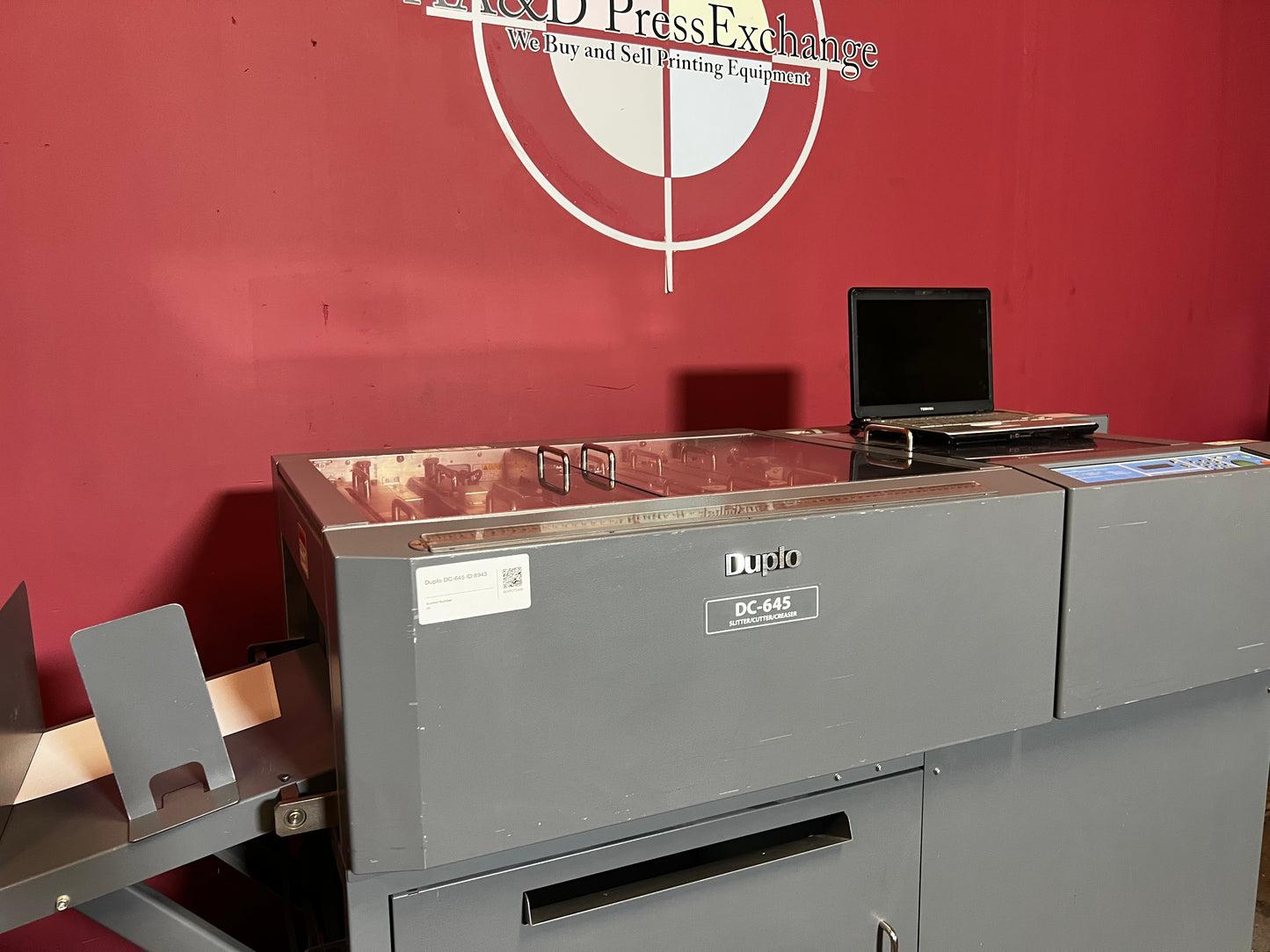 Used Duplo DC-645 Slitter Cutter Creaser side view showing paper guides and stacker – AA&D PressExchange