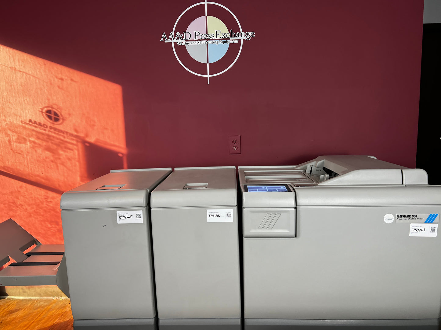 Used Plockmatic 350 production booklet maker side view connected to print press – AA&D PressExchange