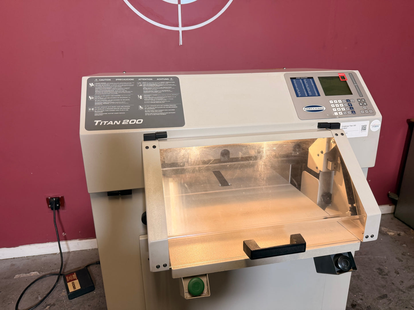 Used Challenge Titan 200 Hydraulic Paper Cutter by AA&D PressExchange, detailed view of powered blade mechanism