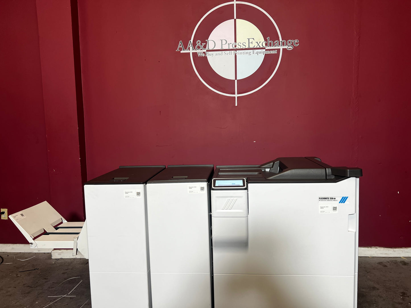Used Plockmatic 350-M booklet maker 28k meter close-up of stitching and folding modules – AA&D PressExchange