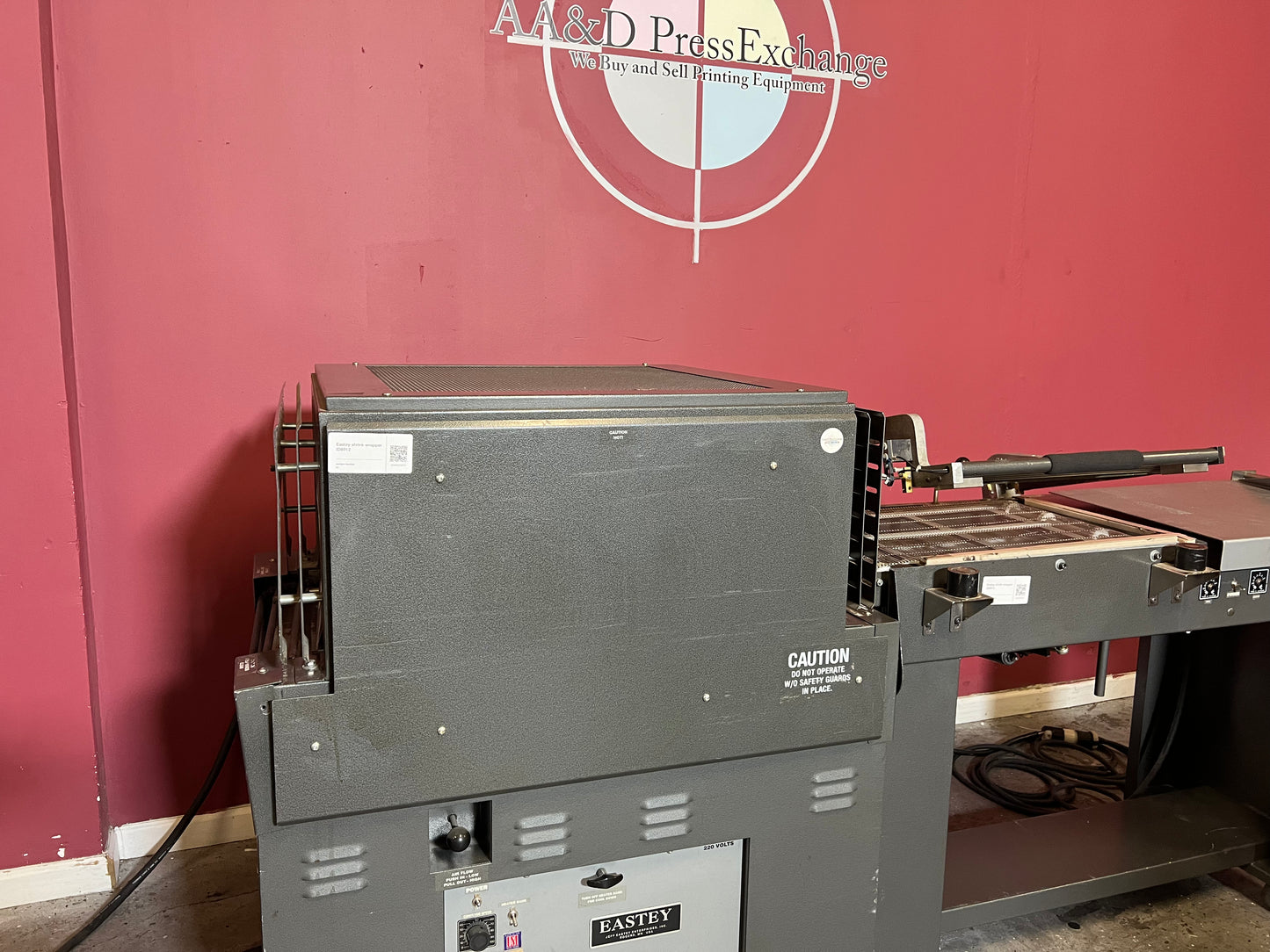 Used Eastey EM1622T Shrink Wrapping Machine with Film Cradle System at AA&D PressExchange