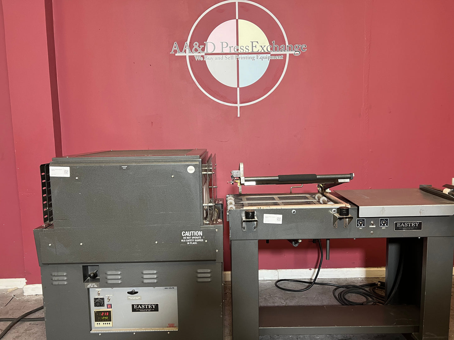 Used Eastey EM1622T Shrink Wrapper with Powered Takeaway Mesh Conveyor at AA&D PressExchange