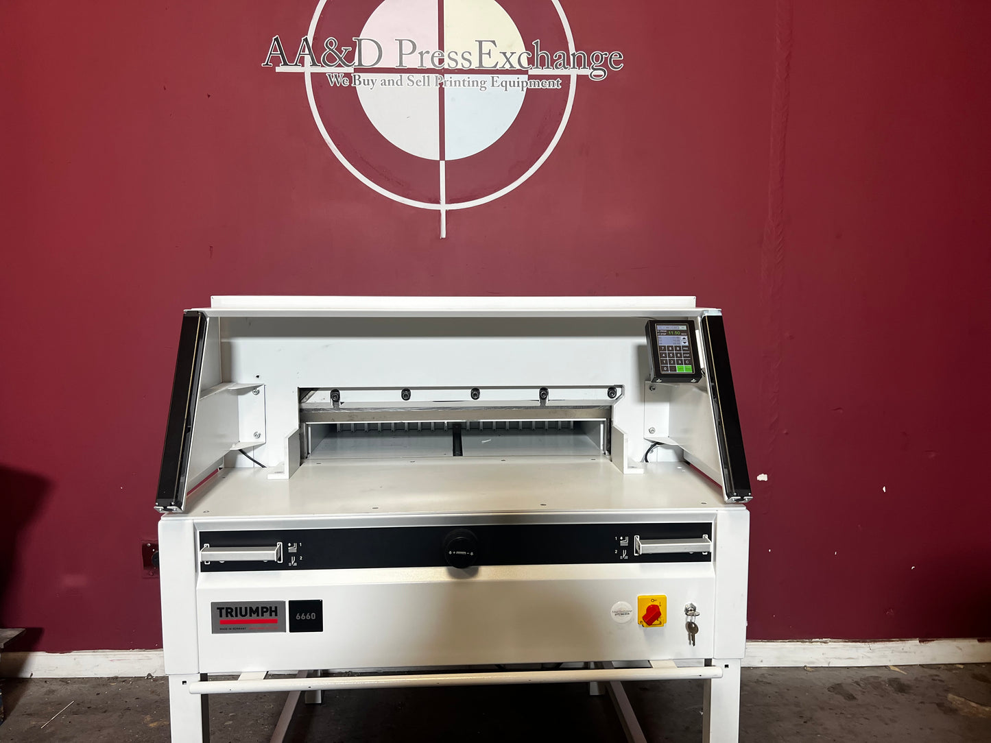 Used Triumph 6660 paper cutter showing back gauge adjustment system – AA&D PressExchange