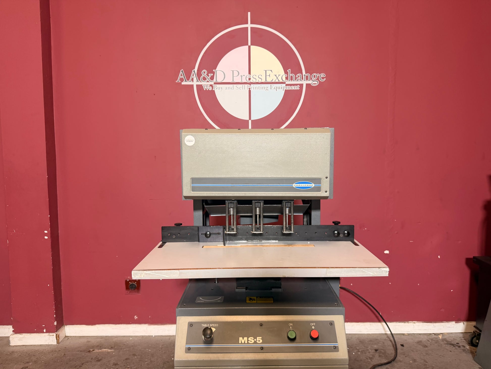 Used Challenge MS-5 hydraulic drill for sale showing adjustable backgauge and side guides