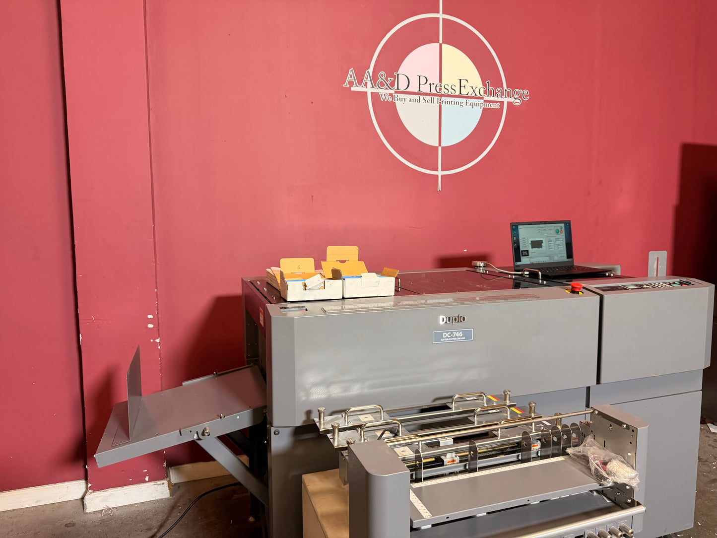Used Duplo DC-746 Slitter Cutter Creaser close up of paper alignment system