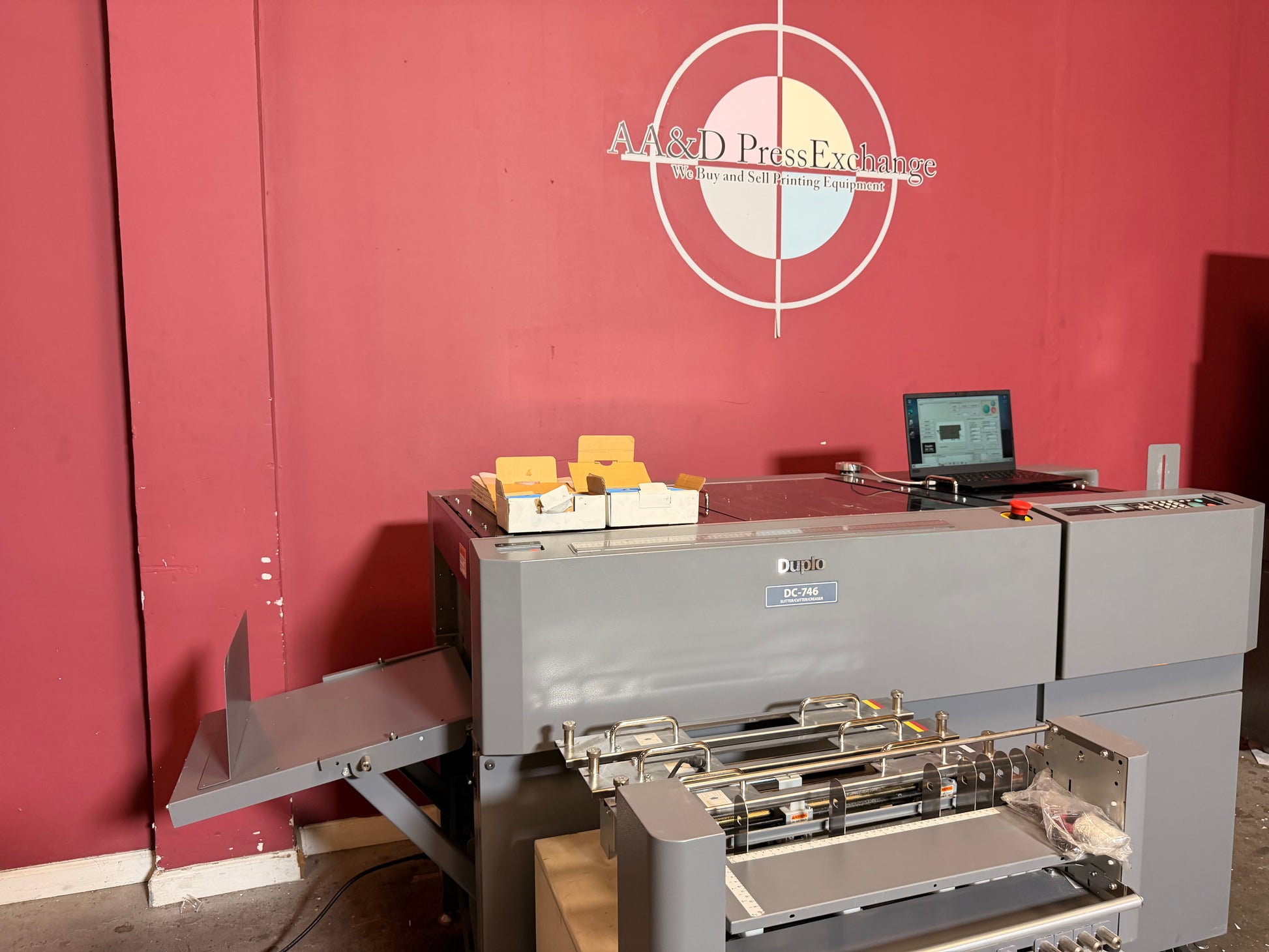 Used Duplo DC-746 Slitter Cutter Creaser close up of paper alignment system