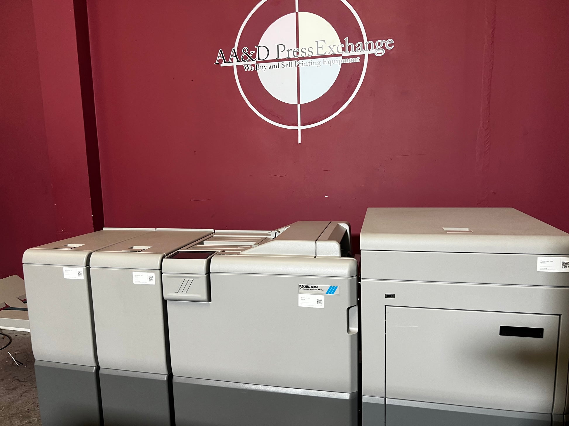 Used Plockmatic 350 70k meter booklet maker rear/side view highlighting saddle-stitch section – AA&D PressExchange
