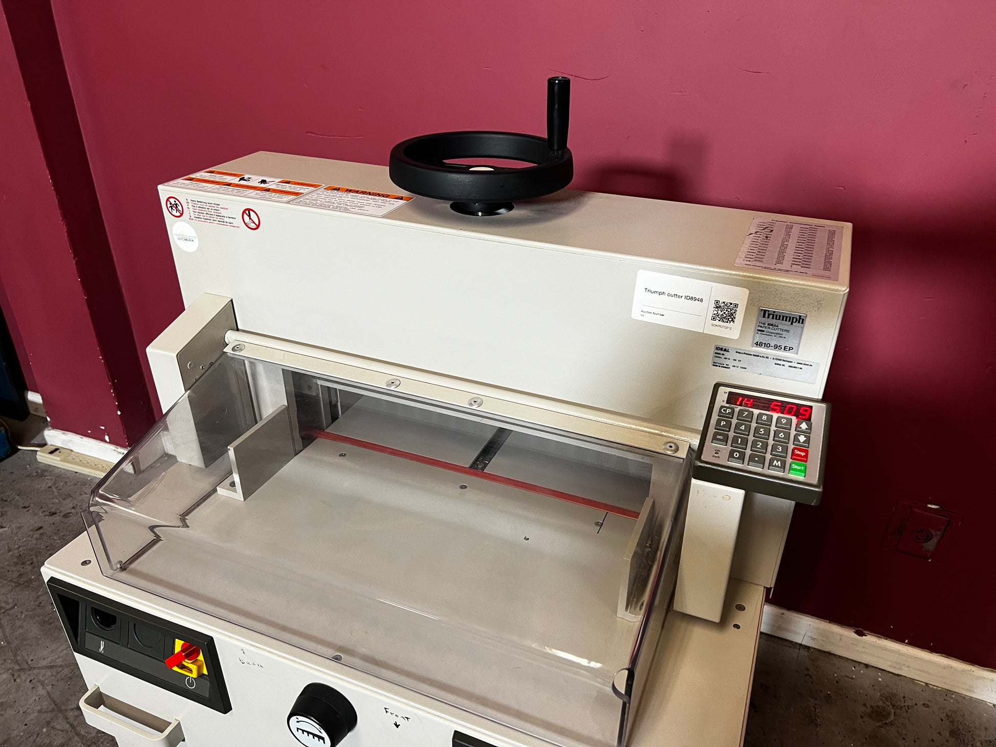 Used Triumph 4810-95EP electric paper cutter showing blade and clamp system – AA&D PressExchange