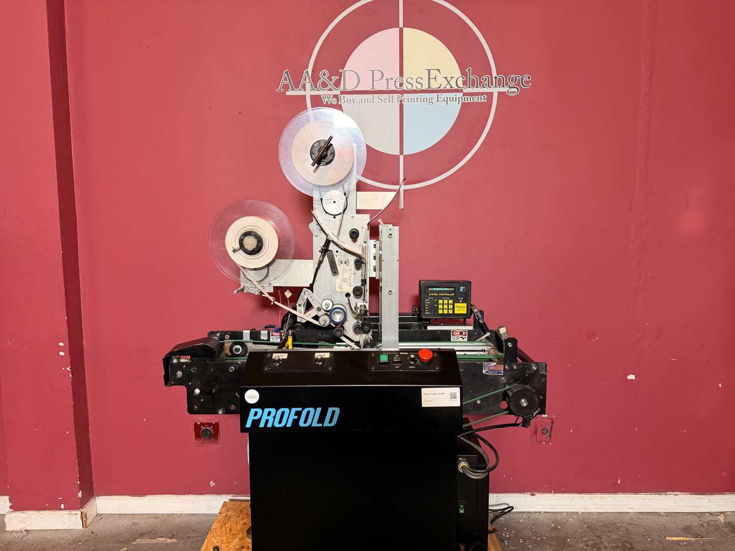 Used Profold tabbing machine control panel and feeder unit close-up for mailing accuracy