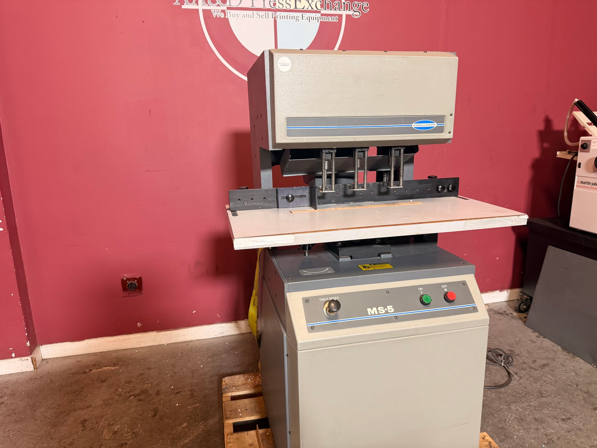 Used Challenge MS-5 hydraulic paper drill for sale showing drilling table surface