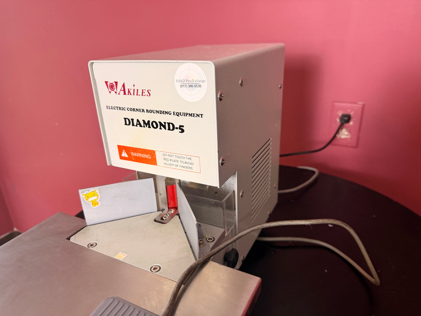 Used Akiles Diamond-5 corner rounder rear view showing base and support structure – AA&D PressExchange