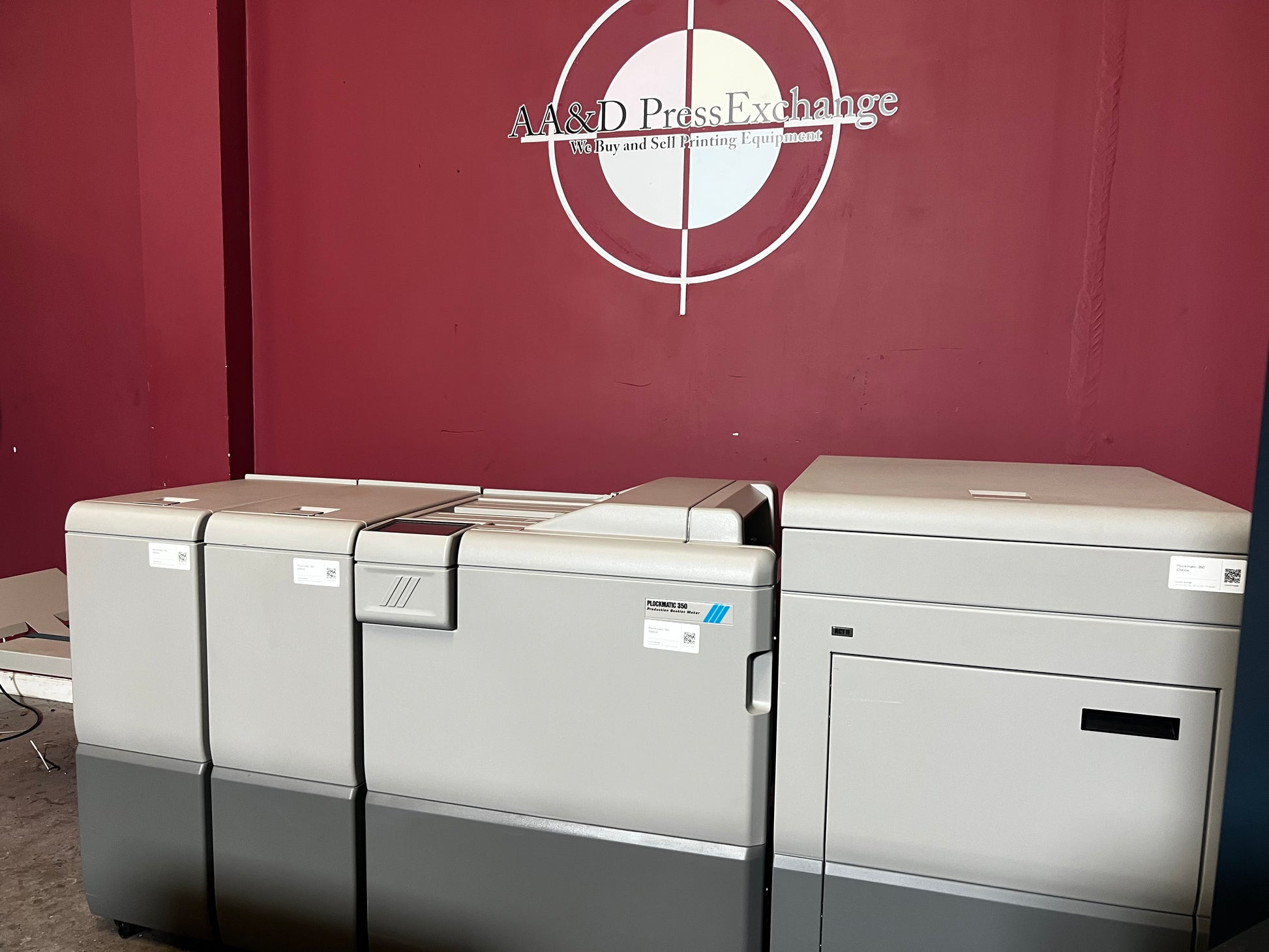 Used Plockmatic 350 70k meter booklet maker angled view showing saddle-stitch unit – AA&D PressExchange
