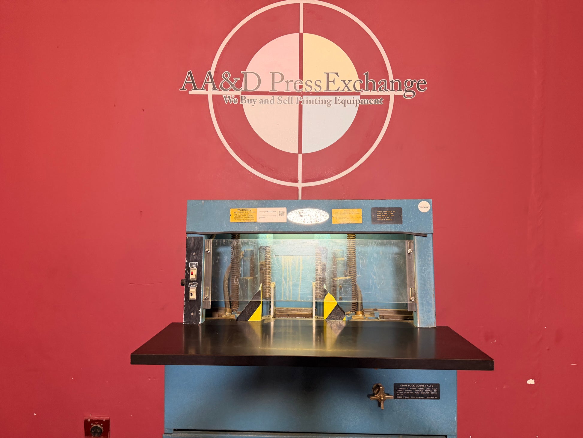 Used Challenge DCM Double Round Cornering Machine side angle showing dual corner cutting heads