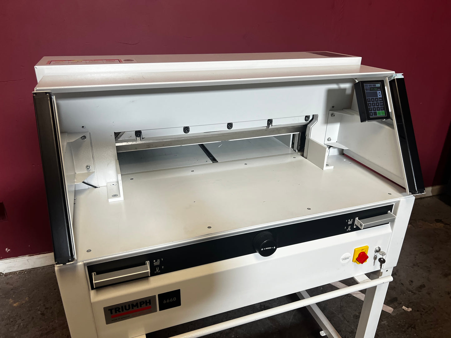 Used Triumph 6660 paper cutter top/angled view in commercial print workflow – AA&D PressExchange