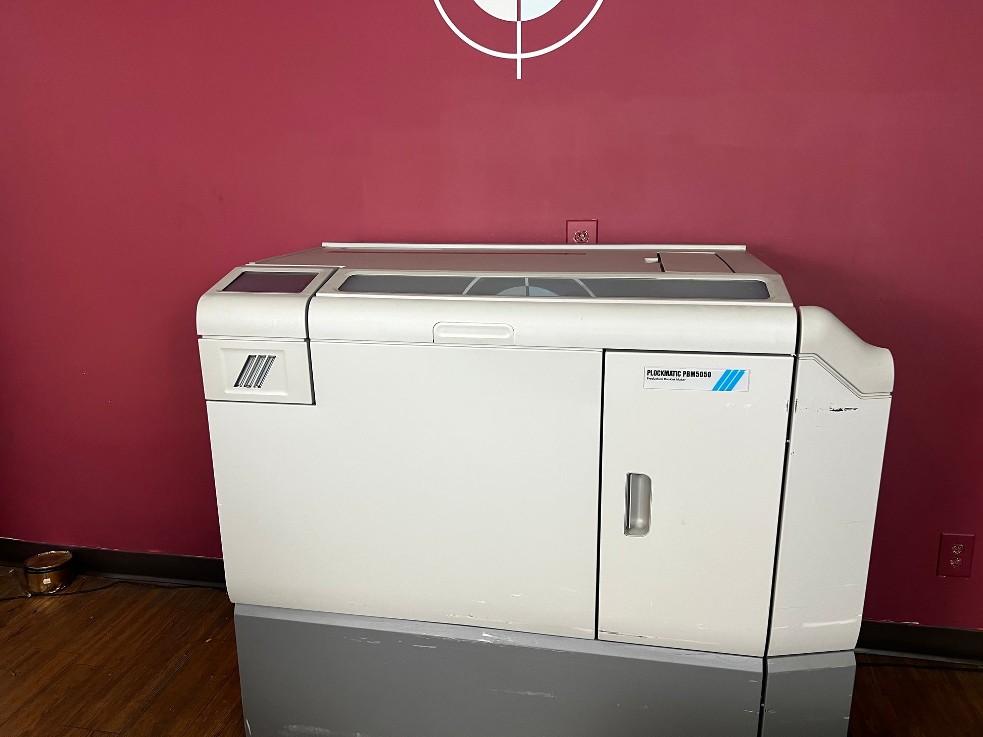 Used Plockmatic 5050 bookletmaker 63k meter angled view showing saddle-stitch and fold functions – AA&D PressExchange
