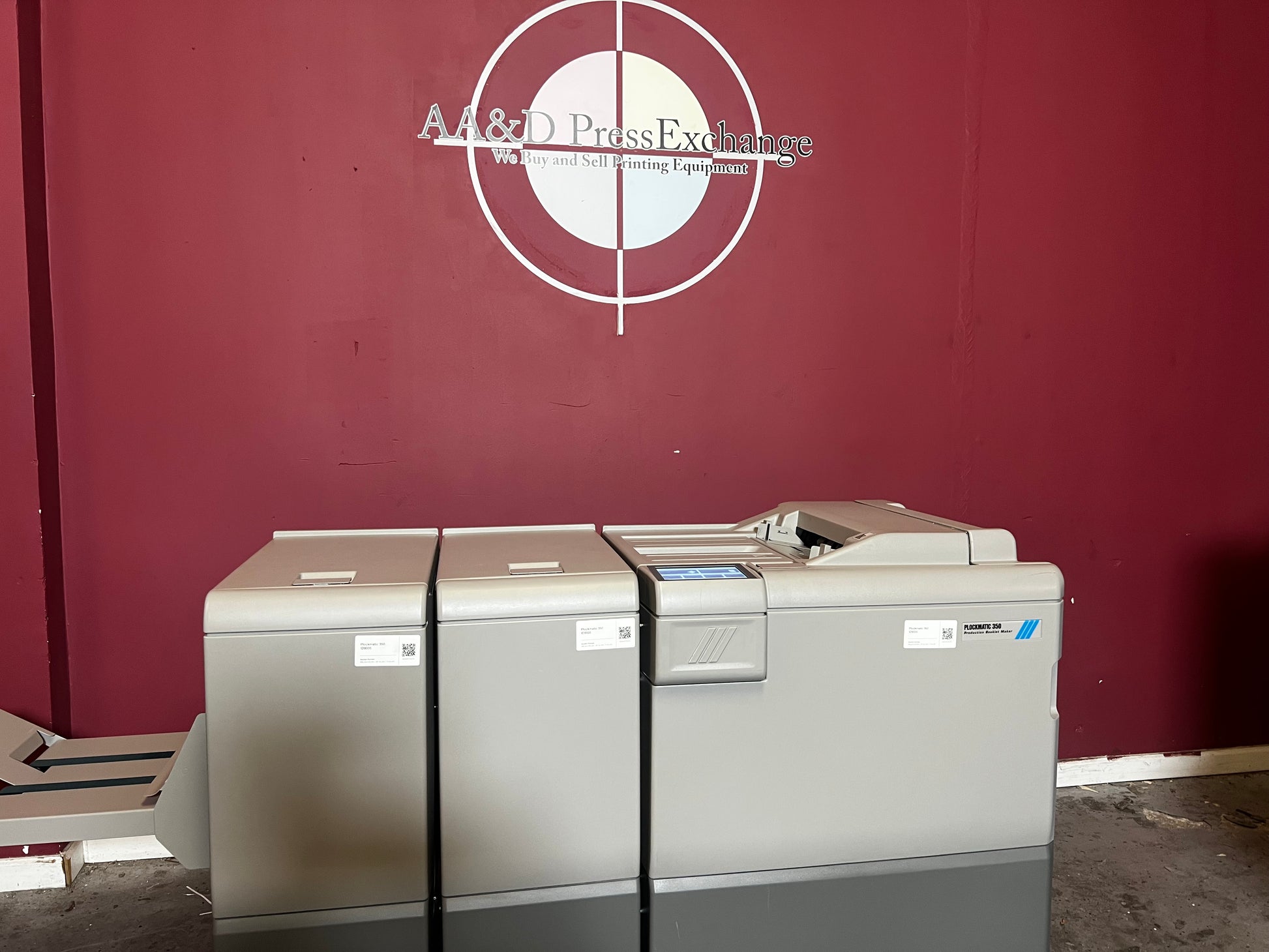 Used Plockmatic 350 64k meter booklet maker angled view showing saddle-stitch and folding unit – AA&D PressExchange
