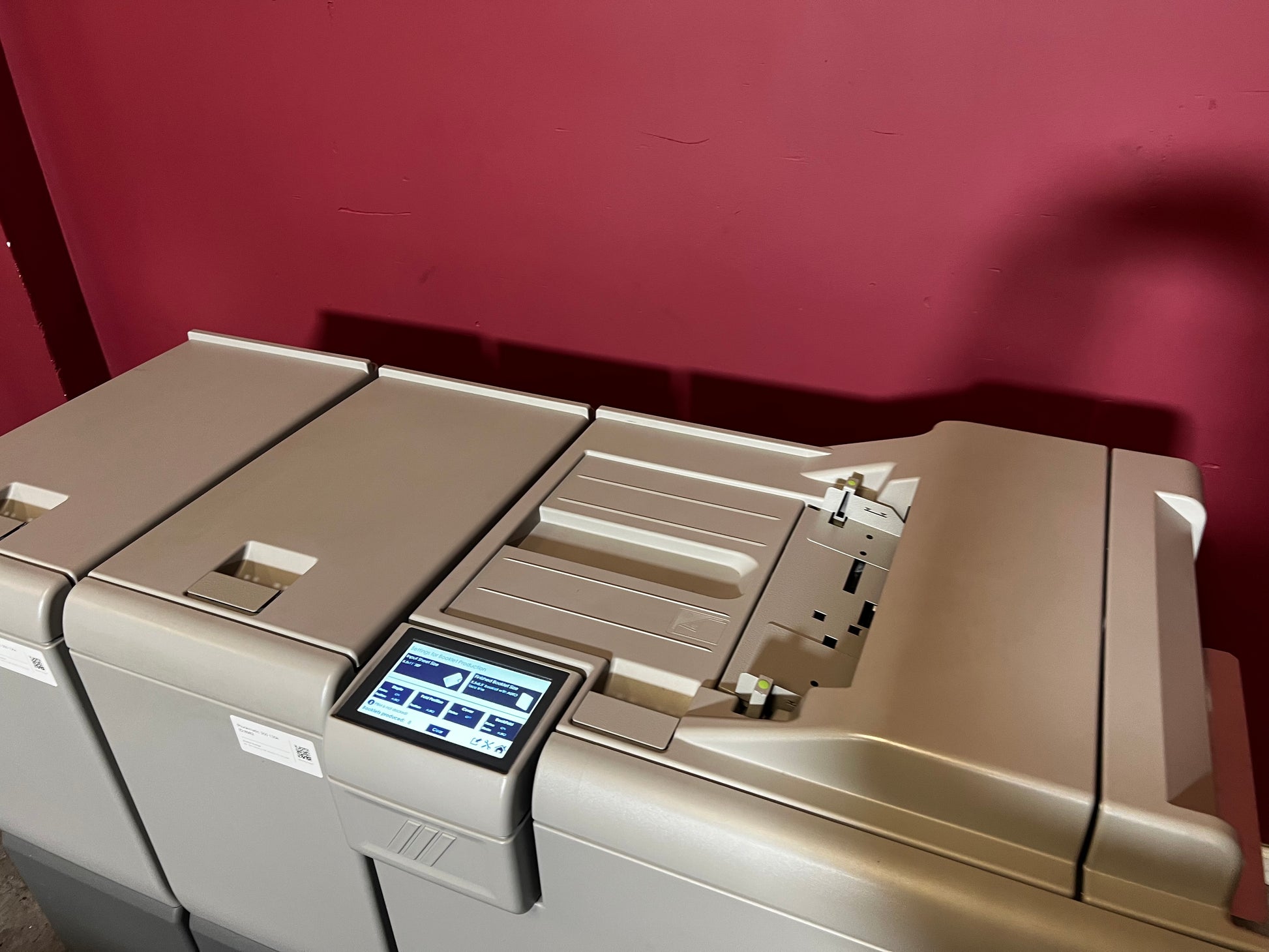 Used Plockmatic 350 bookletmaker 136k rear/angled view showing folded booklet output – AA&D PressExchange