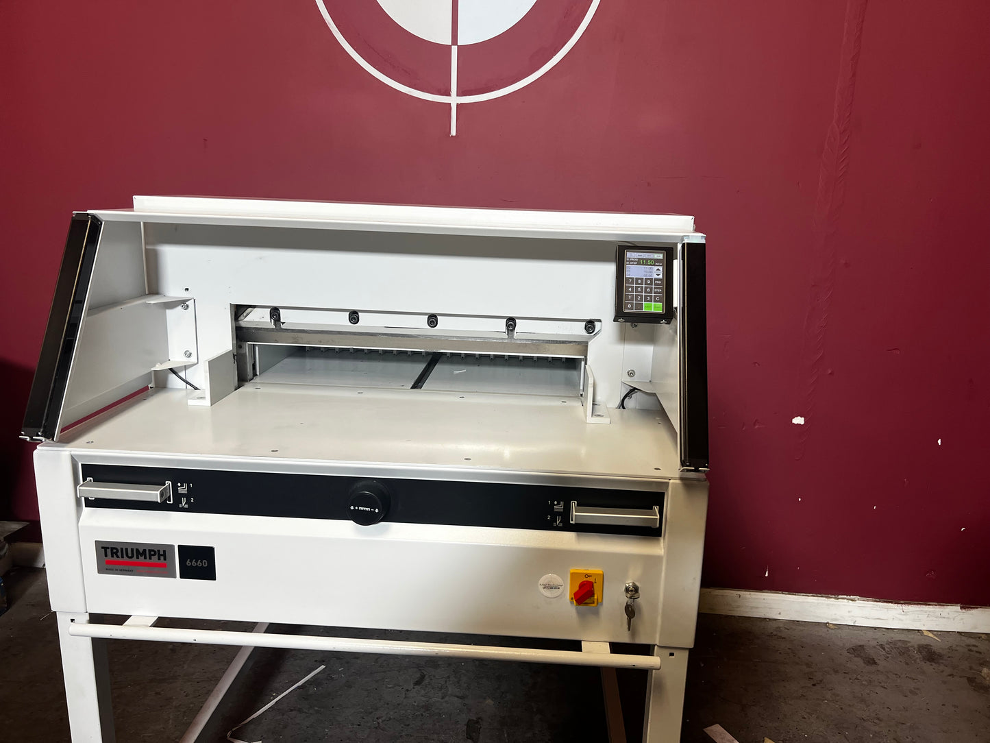 Used Triumph 6660 paper cutter top-down view showing blade and back gauge – AA&D PressExchange