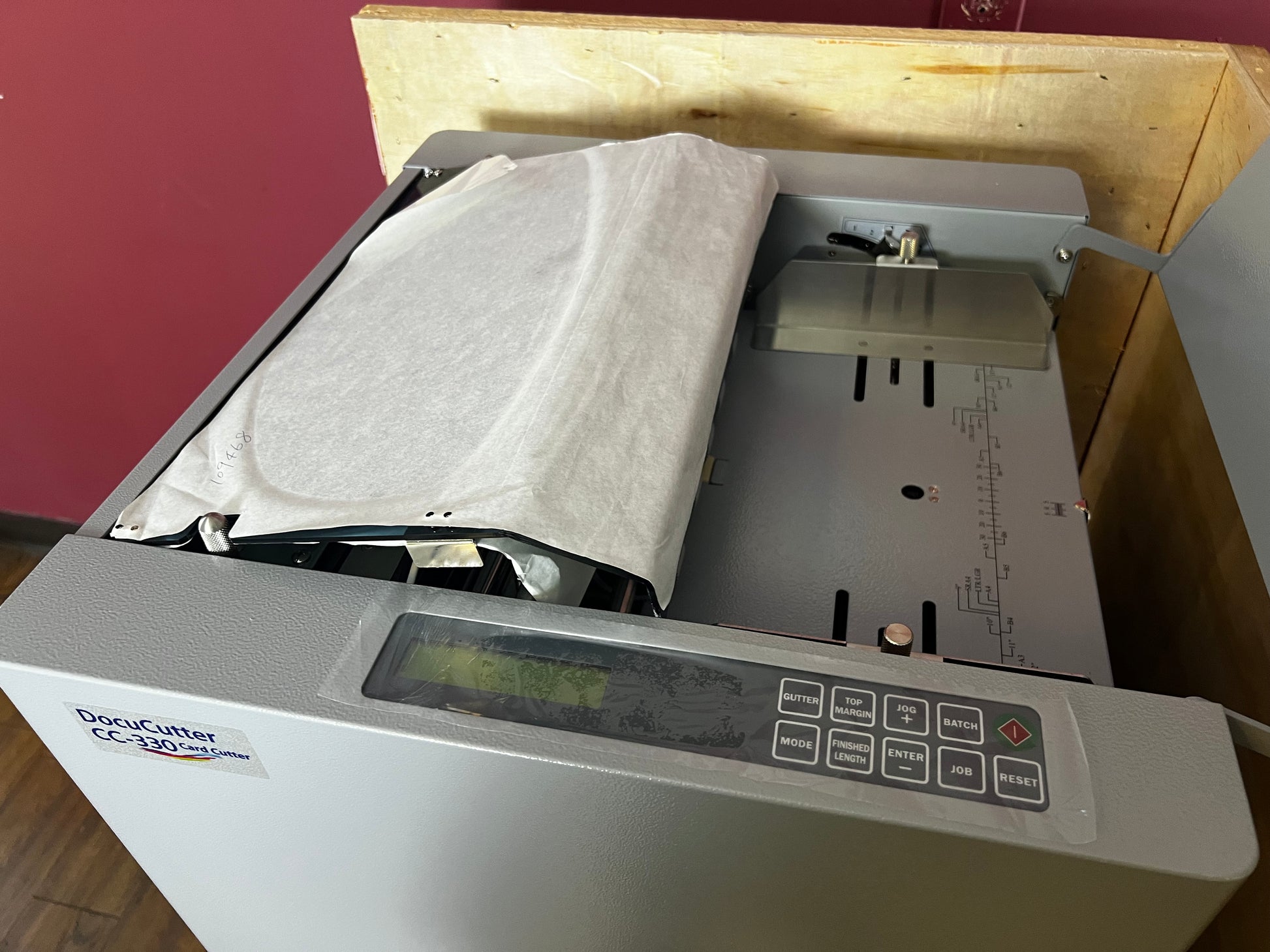 AA&D PressExchange Used Duplo CC-330 Card Cutter with waste bin for easy disposal of trimmings
