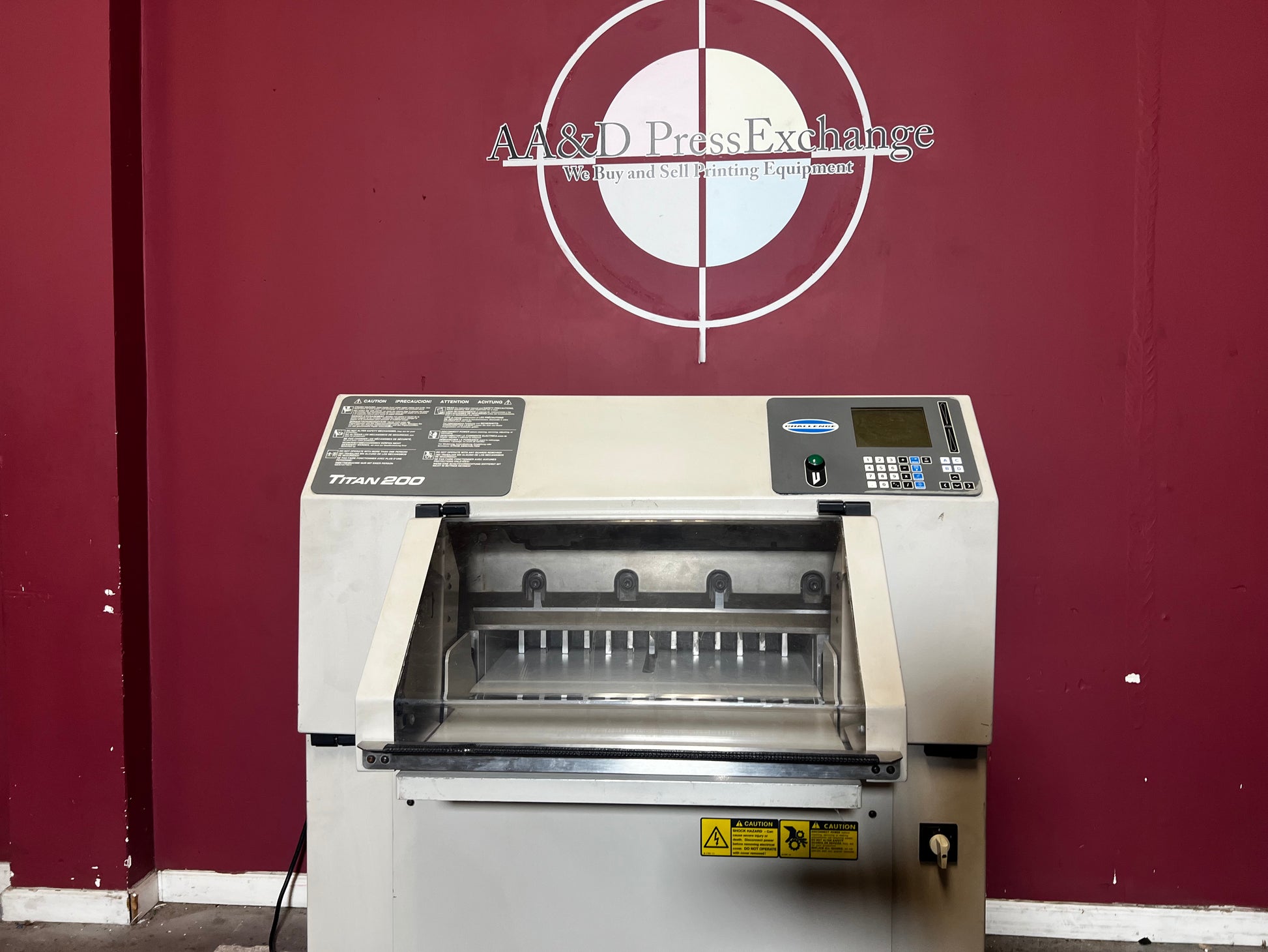 Close-up of hydraulic clamp on used Challenge Titan 200 Paper Cutter, AA&D PressExchange.