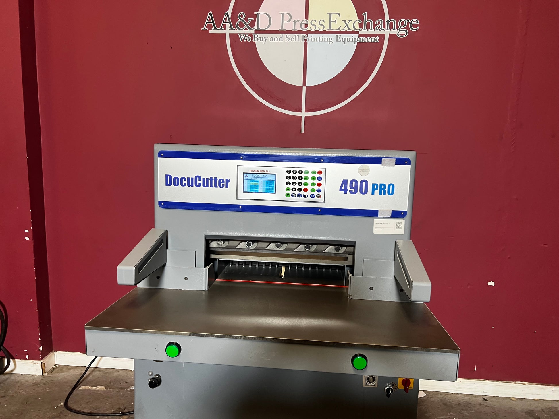 AA&D PressExchange Used Duplo 490 PRO hydraulic paper cutter close-up of touchscreen and control panel