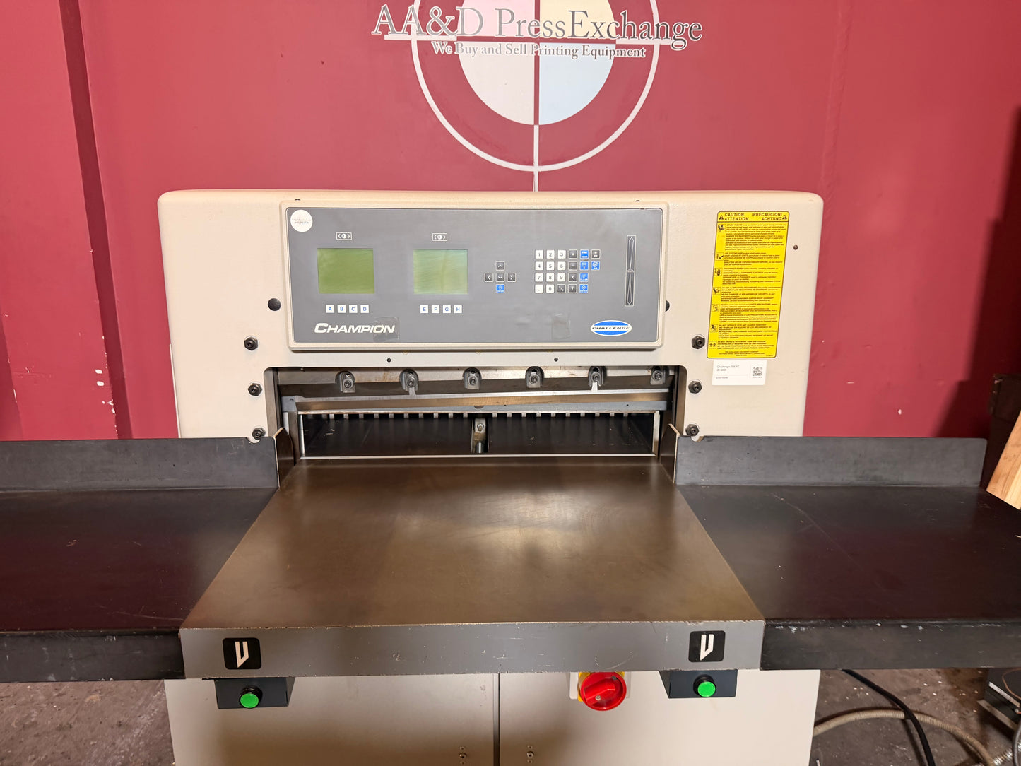 Used Challenge 305 XG foot pedal control hydraulic activation system for hands-free industrial paper cutting workflow